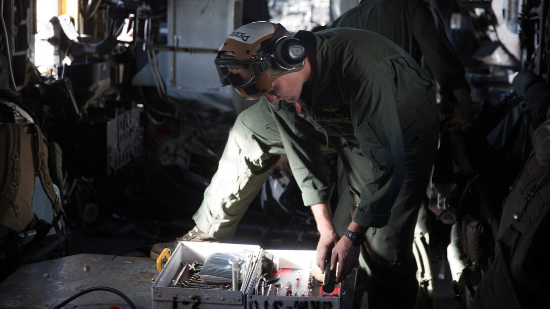 Lance Cpl. Christopher Pickens, a crew chief with Marine Heavy Helicopter Squadron 465 “Warhorse” and an Irvine, Calif. native, puts away tools prior to a training flight aboard Marine Corps Air Station Miramar, California, Nov. 16. Marines with HMH-465 will conduct aerial gun shoots, fire bucket training and terrain flights over the course of five days in El Centro, California. 