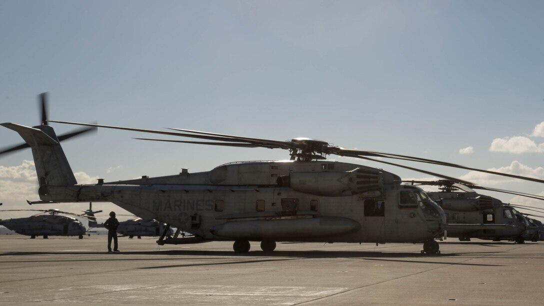 Crew members with Marine Heavy Helicopter Squadron 465 “Warhorse” prepare a CH-53E Super Stallion for flight at Marine Corps Air Station Miramar, California, Nov. 16. Marines with HMH-465 will conduct aerial gun shoots, fire bucket training and terrain flights over the course of five days in El Centro, California.