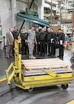 Army Lt. Col. Jacob Freeman gives Maj. Gen. Mehmet Özoğlu and other members of the Turkish Land Forces Command a tour through the Eastern Distribution Center at DLA Distribution Susquehanna, Pa.