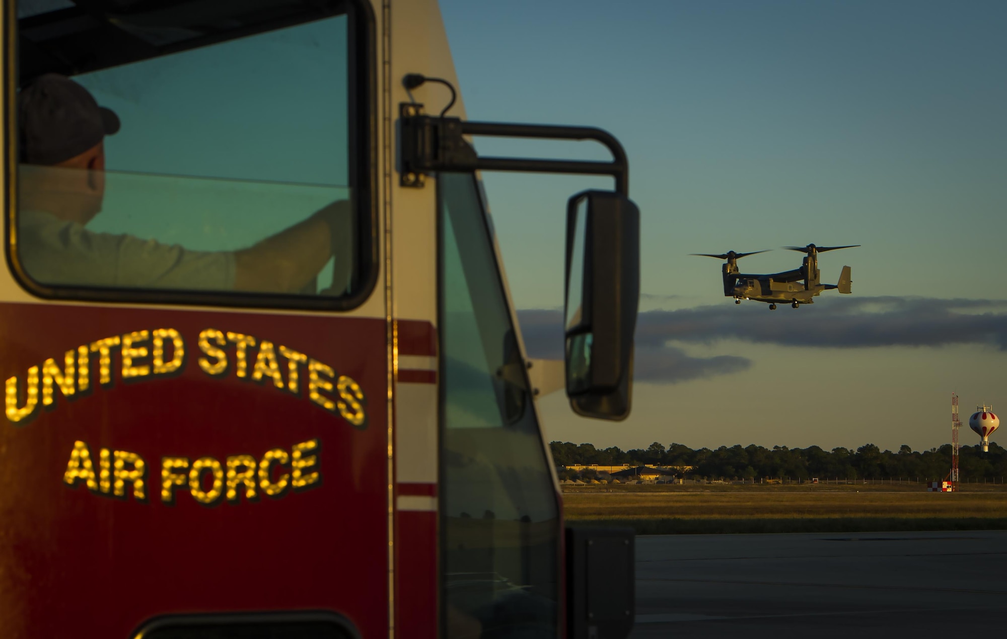 Members with the 1st Special Operations Civil Engineer Squadron Fire Department wait for a CV-22B Osprey to land during Col. Ted Corallo’s“fini flight” at Hurlburt Field, Fla., Nov. 10, 2015. Corallo graduated from the U.S. Air Force Academy in 1989 and went on to undergraduate pilot training at Columbus Air Force Base, Miss. He served as the Air Force Special Operations Command chief of staff for the last 18 months. (U.S. Air Force photo by Senior Airman Christopher Callaway)