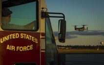 Members with the 1st Special Operations Civil Engineer Squadron Fire Department wait for a CV-22B Osprey to land during Col. Ted Corallo’s“fini flight” at Hurlburt Field, Fla., Nov. 10, 2015. Corallo graduated from the U.S. Air Force Academy in 1989 and went on to undergraduate pilot training at Columbus Air Force Base, Miss. He served as the Air Force Special Operations Command chief of staff for the last 18 months. (U.S. Air Force photo by Senior Airman Christopher Callaway)