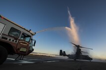 A CV-22B Osprey taxis under a water salute performed by the 1st Special Operations Civil Engineer Squadron during Col. Ted Corallo’s, “fini flight” at Hurlburt Field, Fla., Nov. 10, 2015. In his career, Corallo piloted 10 different aircraft platforms including the Cessna T-37, MC-130H Combat Talon II, and the Osprey. He served as the Air Force Special Operations Command chief of staff for the last 18 months.  (U.S. Air Force photo by Senior Airman Christopher Callaway) 