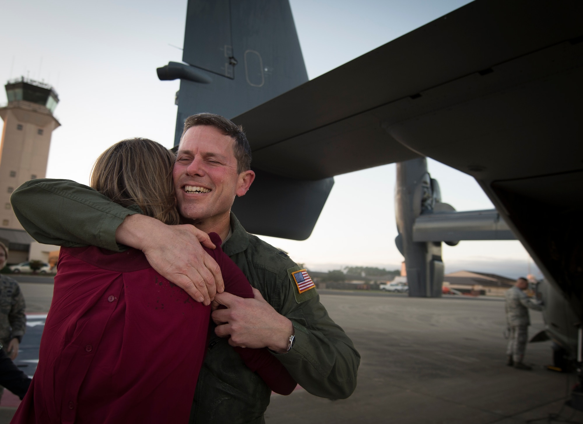 Col. Ted Corallo, Air Force Special Operations Command chief of staff, embraces his wife, Jamee, after his “fini flight” at Hurlburt Field, Fla., Nov. 10, 2015. Corallo logged more than 3,600 flight hours in his career. (U.S. Air Force photo by Senior Airman Christopher Callaway)