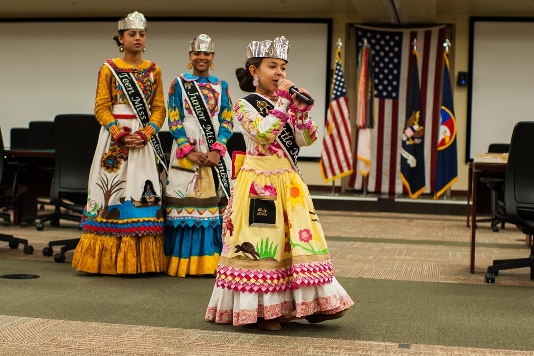 Chloe Grace Locklear, 8, Little Miss Lumbee, shares the story of the Lumbee Tribe during the U.S. Army Forces Command and U.S. Army Reserve Command National American Indian Heritage event, hosted by both command's Equal Opportunity directorates, at the U.S. Army Forces Command and U.S. Army Reserve Command headquarters, Nov. 18, 2015. The event recognized three members of the Lumbee Tribe of North Carolina, the tribe's contributions to America and the nation's history. (U.S. Army photo by Timothy L. Hale/Released)