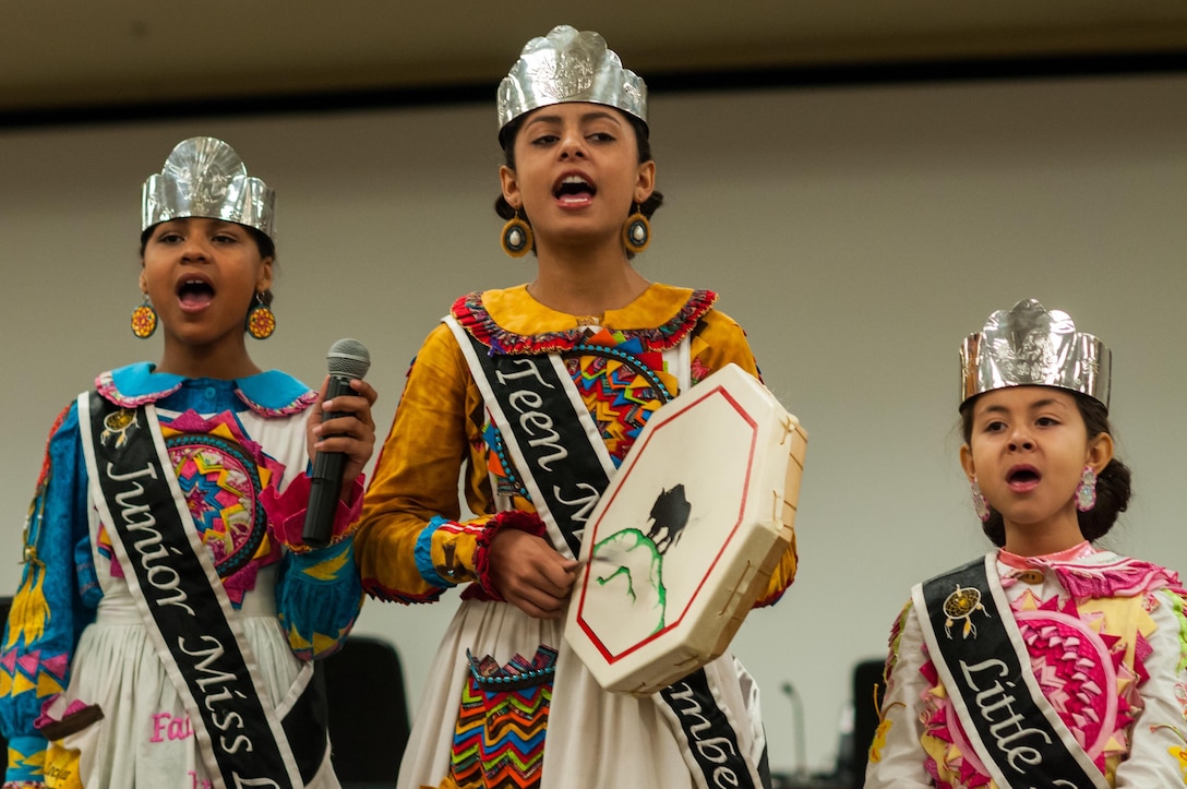 Kyla Leigh-Ann Jarrett, left, Kaitlyn Marie Deal, center, and Chloe Grace Locklear sing a traditional Native American song during the U.S. Army Forces Command and U.S. Army Reserve Command National American Indian Heritage event, hosted by both command's Equal Opportunity directorates, at the U.S. Army Forces Command and U.S. Army Reserve Command headquarters, Nov. 18, 2015. The event recognized three members of the Lumbee Tribe of North Carolina, the tribe's contributions to America and the nation's history. (U.S. Army photo by Timothy L. Hale/Released)
