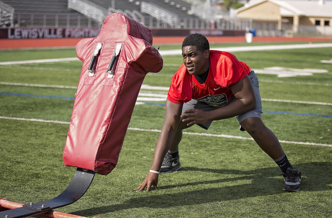 Denzel Okafor, football player for Lewisville High School, was selected to play in the Semper Fidelis All-American Bowl airing Jan. 3, 2016. Players selected are well-rounded individuals, not only are they distinguished athletes, but also have academic achievements and display exemplary moral characteristics. (U.S. Marine Corps photo by Sgt. Rebecca Eller)