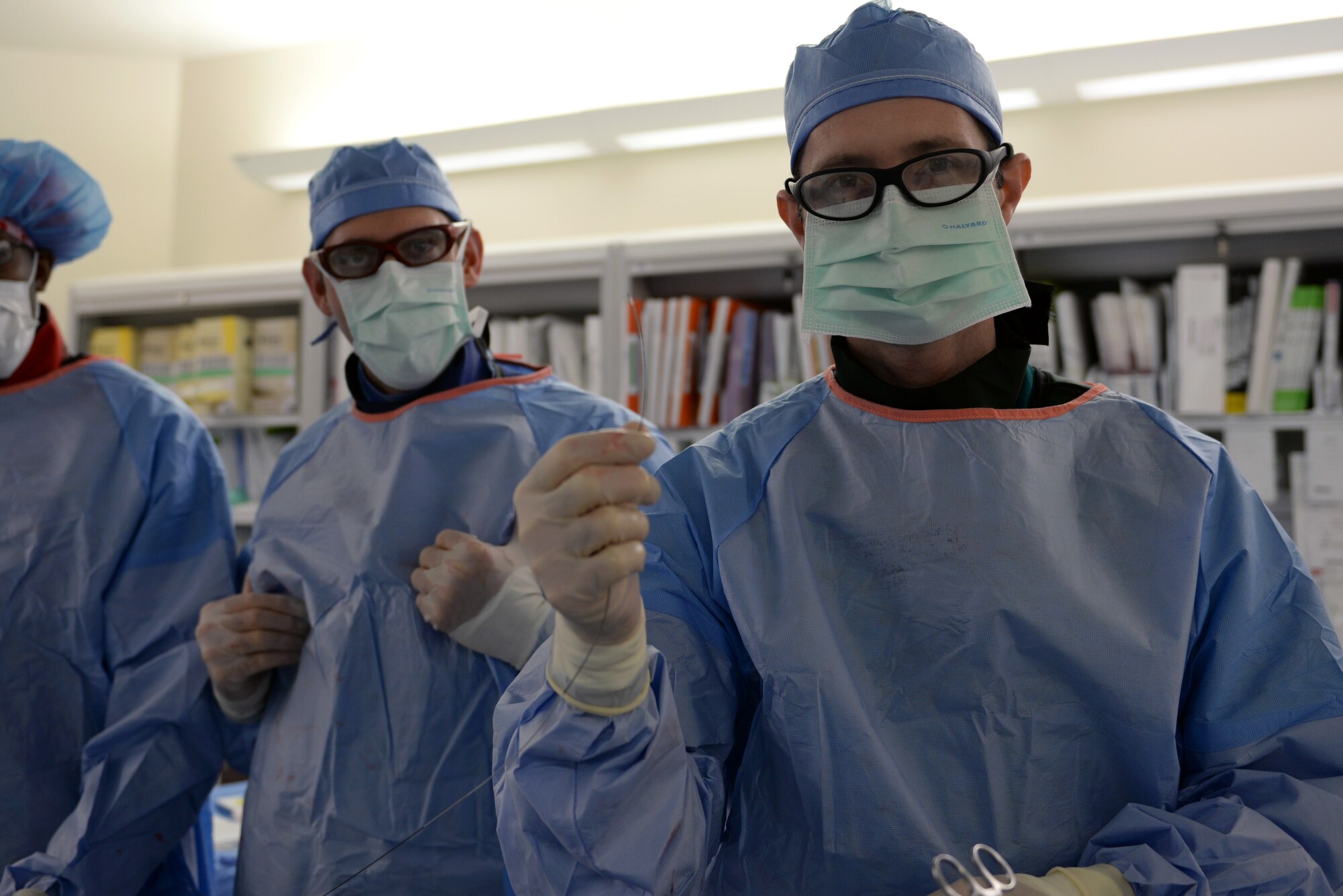 Lt. Col. (Dr.) Matthew Hann, 81st Medical Operations Squadron catheterization laboratory director, prepares to deploy the Synergy Stent into a patient’s artery via their wrist to clear a blockage, Nov. 4, 2015, Keesler Air Force Base, Miss. The stent combines features of older-style bare metal stents and newer drug-eluding stents, and has a bio-absorbable polymer layer which holds medicine to the stent. Currently, the Keesler Medical Center is the only hospital in the Defense Department to offer this new technology, and one of only 20 hospitals in the United States. (U.S. Air Force photo by Senior Airman Duncan McElroy)