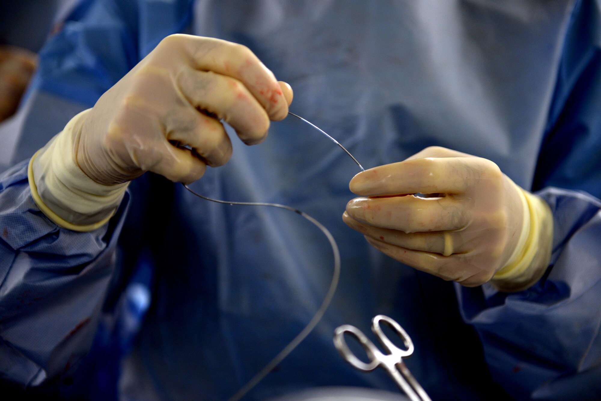 Lt. Col. (Dr.) Matthew Hann, 81st Medical Operations Squadron catheterization laboratory director, prepares to deploy the Synergy Stent into a patient’s artery via their wrist to clear a blockage, Nov. 4, 2015, Keesler Air Force Base, Miss. The stent combines features of older-style bare metal stents and newer drug-eluding stents, and has a bio-absorbable polymer layer which holds medicine to the stent. Currently, the Keesler Medical Center is the only hospital in the Defense Department to offer this new technology, and one of only 20 hospitals in the United States. (U.S. Air Force photo by Senior Airman Duncan McElroy)