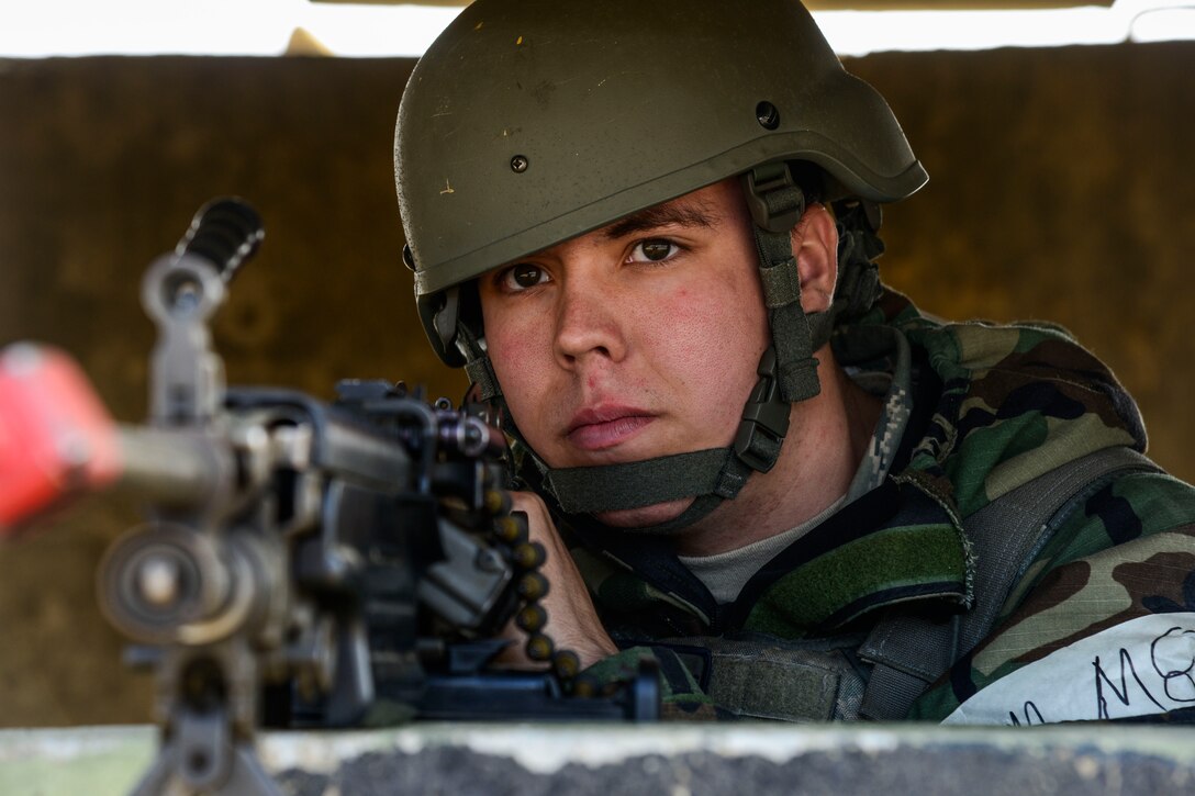 Airman Jaden Santos, 35th Security Forces Squadron, Misawa Air Base, Japan, installation entry controller, scans for opposing forces during readiness exercise Vigilant Ace 16 at Osan Air Base, Republic of Korea, Nov. 4, 2015. Santos is one of more than 1,000 augmentees participating in the large-scale exercise. Vigilant Ace 16 is peninsula-wide, providing ROK and U.S. armed forces the opportunity to hone resourceful skills used in the event of real-world contingencies. (U.S. Air Force photo by Senior Airman Kristin High/Released)