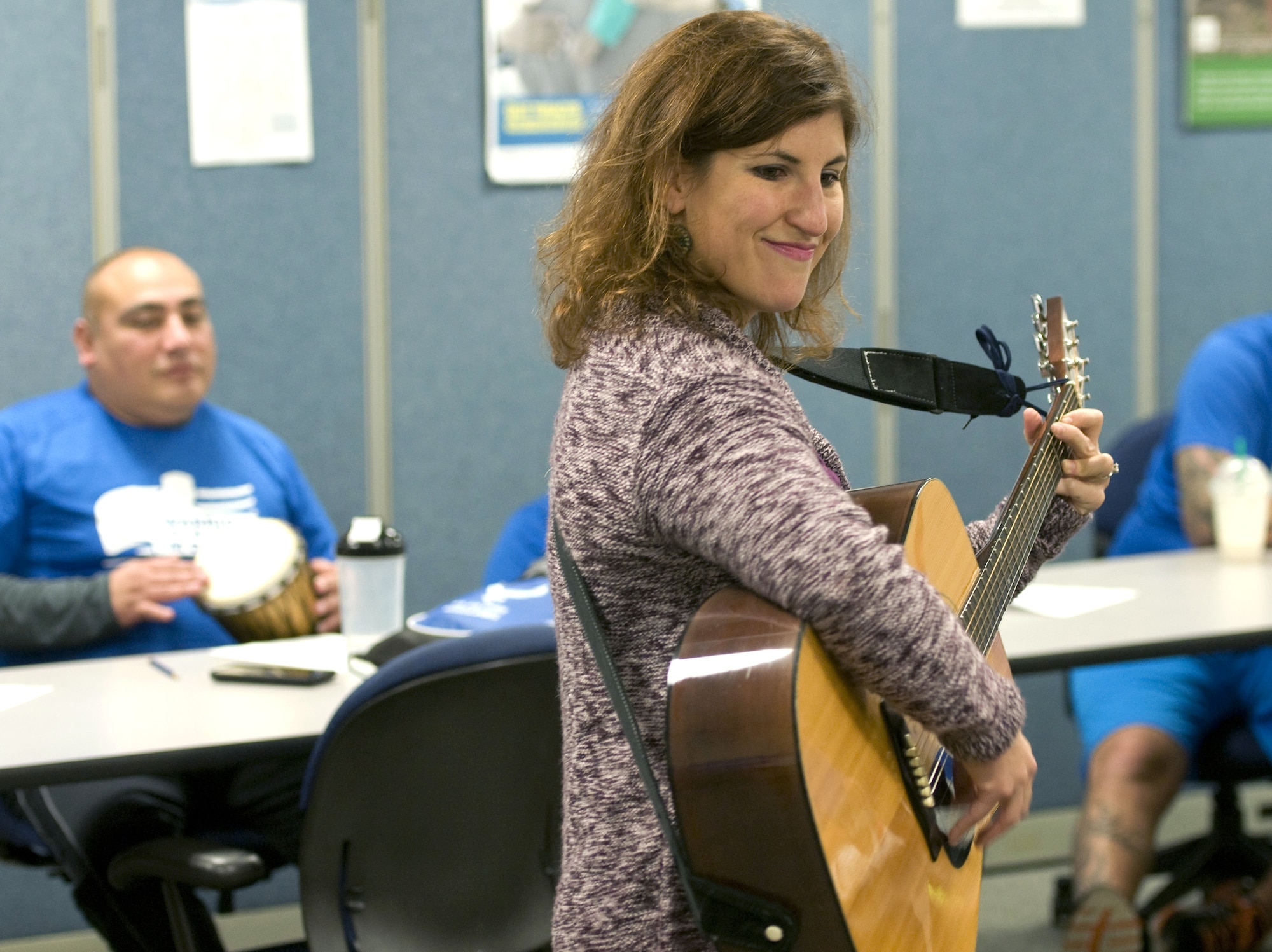 Nicki Rubin, a music therapist, encourages wounded Airmen to interact during a music therapy session Nov. 19, 2015, on Joint Base Andrews, Md., as part of Warrior CARE Month. Airmen had the chance to use a variety of musical instruments and collaborate on songs in the sessions, which were intended to show wounded warriors a unique approach to therapy. (U.S. Air Force photo/Sean Kimmons)