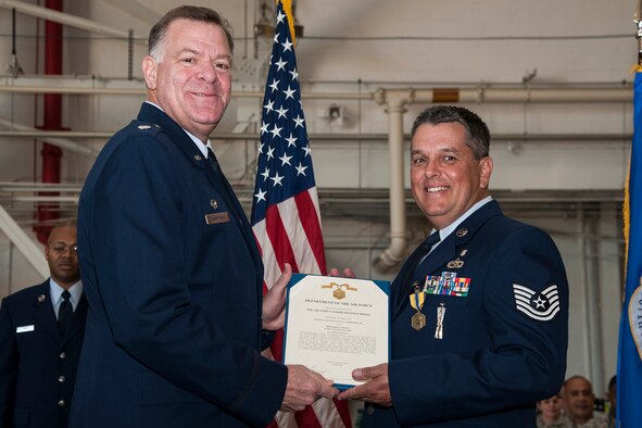 U.S. Air Force Lt. Col. Leo Kamphaus, 307th Maintenance Group (MXG) commander, presents the Air Force Commendation Medal to Tech. Sgt. Jesus Rodriguez during a Commander’s Call on Nov. 8, 2015, Barksdale Air Force Base, La. Rodriguez received the medal for distinguished meritorious service while assigned to the 307th Aircraft Maintenance Squadron, 307th MXG, 307th Bomb Wing, from May 31, 2010 to May 31, 2015. (U.S. Air Force photo by Master Sgt. Greg Steele/Released)