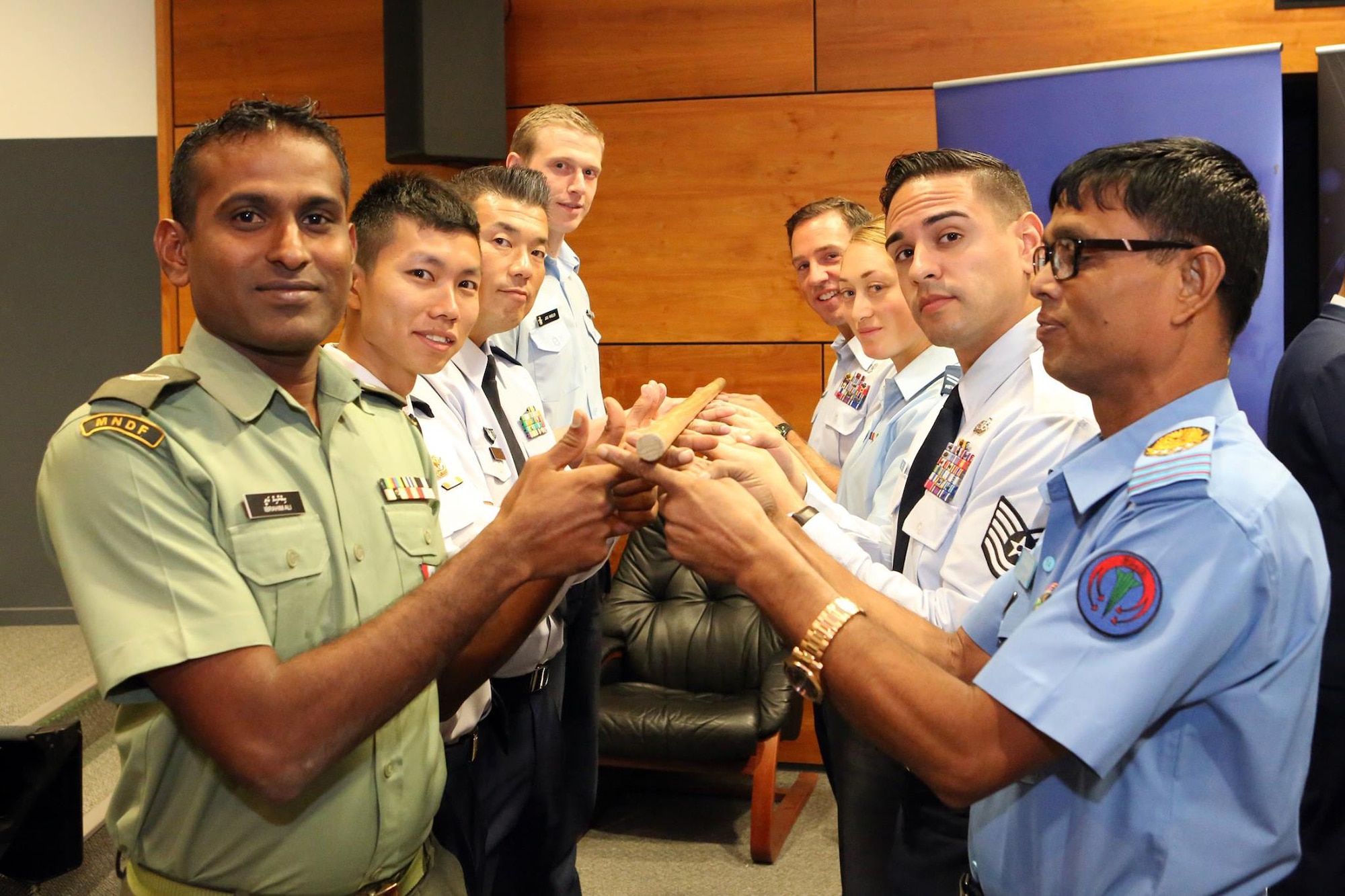 U.S. Air Force Tech. Sgt Luis Reyes (right side, second from front), 36th Wing Command Chief executive assistant, conducts a leadership challenge with Pacific Region Junior Enlisted Airmen at the first Pacific Rim Junior Enlisted Leadership Forum in Canberra, Australia, Sept. 29, 2015. Reyes joined Airmen from 12 countries to share experiences and learn about each other’s leadership techniques and improve leadership growth and partnerships in the forum.  (Courtesy photo)