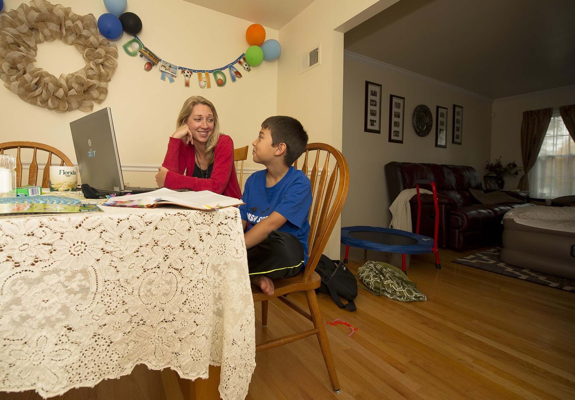 Heather Gray teaches her son, Garrett, 9, during a home school session Nov. 10, 2015, at a friend’s house in Virginia. Heather started home schooling her children at the start of this school year. Heather and her three children moved from Colorado, where her husband David was stationed at Fort Carson, earlier this year for the first time since his death. (U.S. Air Force photo/Staff Sgt. Christopher Gross) 