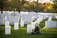 Heather Gray sits in front of the headstone for her husband, Maj. David Gray, at Arlington National Cemetery, Va., Nov. 11, 2015. Her husband was killed in action Aug. 8, 2012, during a deployment to Afghanistan. Heather and her three children moved from Colorado, where David was stationed at Fort Carson, earlier this year for the first time since his death. (U.S. Air Force photo/Staff Sgt. Christopher Gross)
