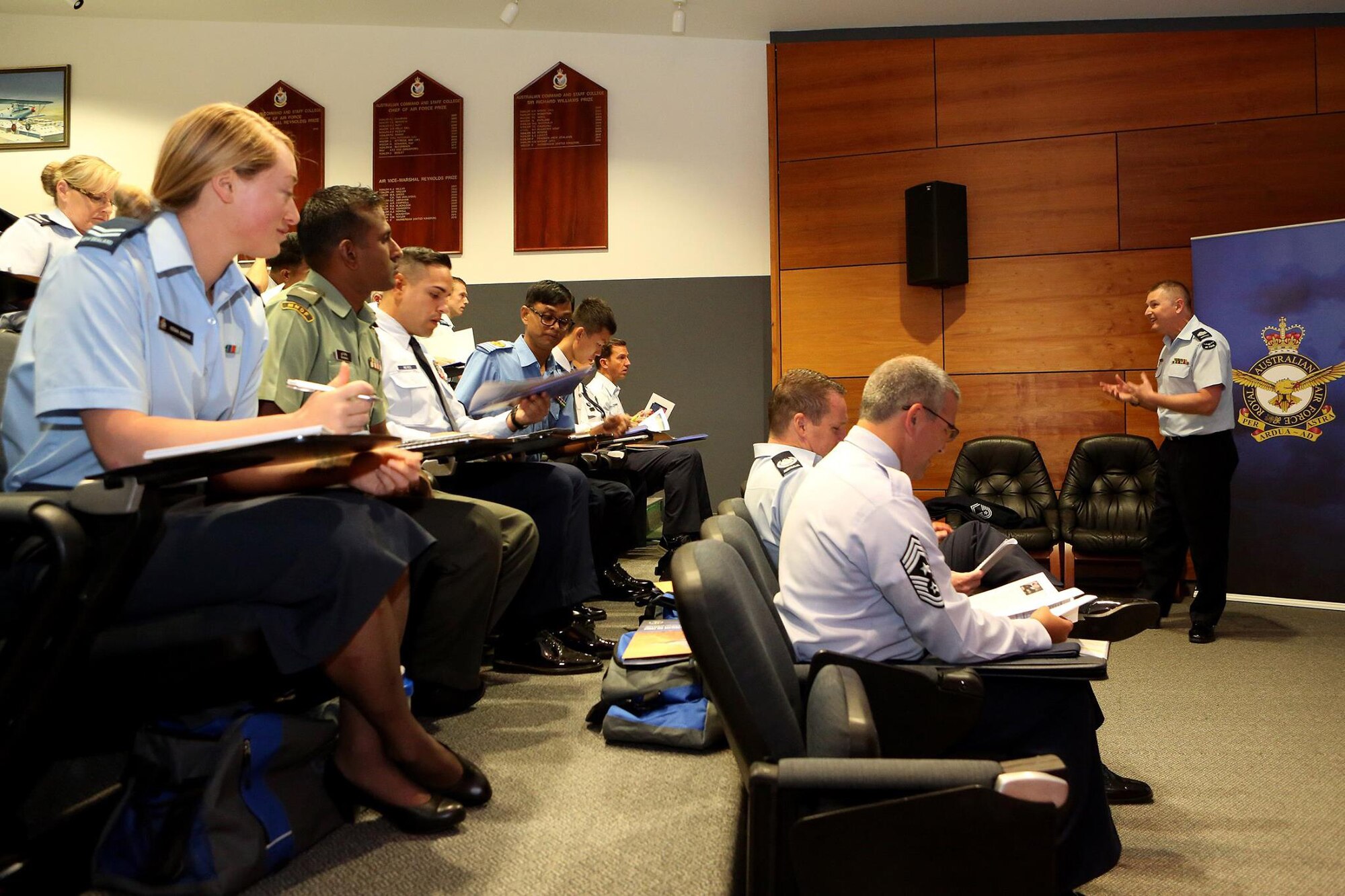 Royal Australian Air Force Warrant Officer David Coles gives a presentation on 'Air Power across the Pacific' to the Pacific Region Junior Enlisted Airmen at the first Pacific Rim Junior Enlisted Leadership Forum in Canberra, Australia, Sept. 29, 2015. The forum allowed participants to share experiences concerning leadership and fundamentals of air power across the Pacific. (Courtesy photo)