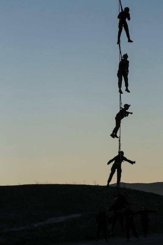 U.S. Marines with Golf Co., Battalion Landing Team 2/1, 13th Marine Expeditionary Unit (MEU), are lifted in the air during Special Patrol Insertion and Extraction (SPIE) rigging training at Camp Pendleton, Calif., Nov. 19, 2015. SPIE rigging training prepares Marines for fast entry and exit from difficult and possibly dangerous combat areas. (U.S. Marine Corps photo by Cpl. Briauna Birl/RELEASED)