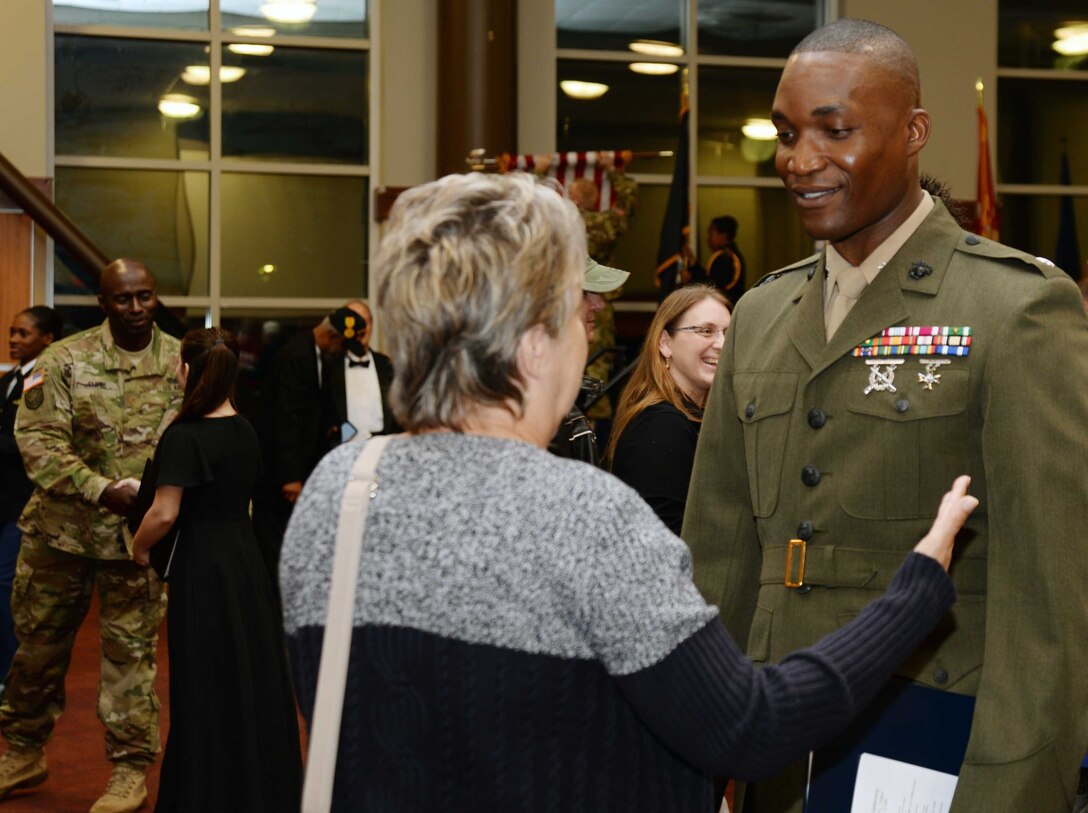 Lt. Col. Nathaniel Robinson, executive officer, Marine Corps Logistics Base Albany, visits with a participant following the Veterans Day ceremony at Darton State College, Albany, Georgia, Nov. 10.