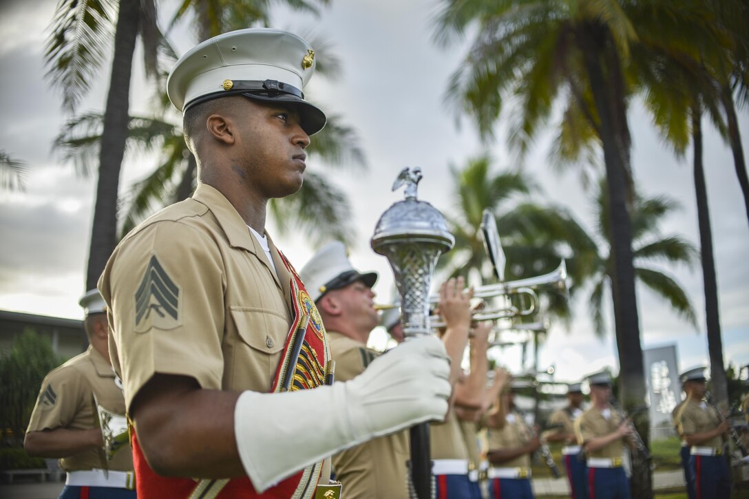 Marines with the U.S. Marine Corps Forces, Pacific Band stand ready for the beginning of the Pearl Harbor Colors, Honors and Heritage Ceremony at the World War II Valor in the Pacific National Monument, Hawaii, Nov. 19, 2015. The ceremony is held once a month to honor the sacrifices of our armed forces, both those serving now and those have served.