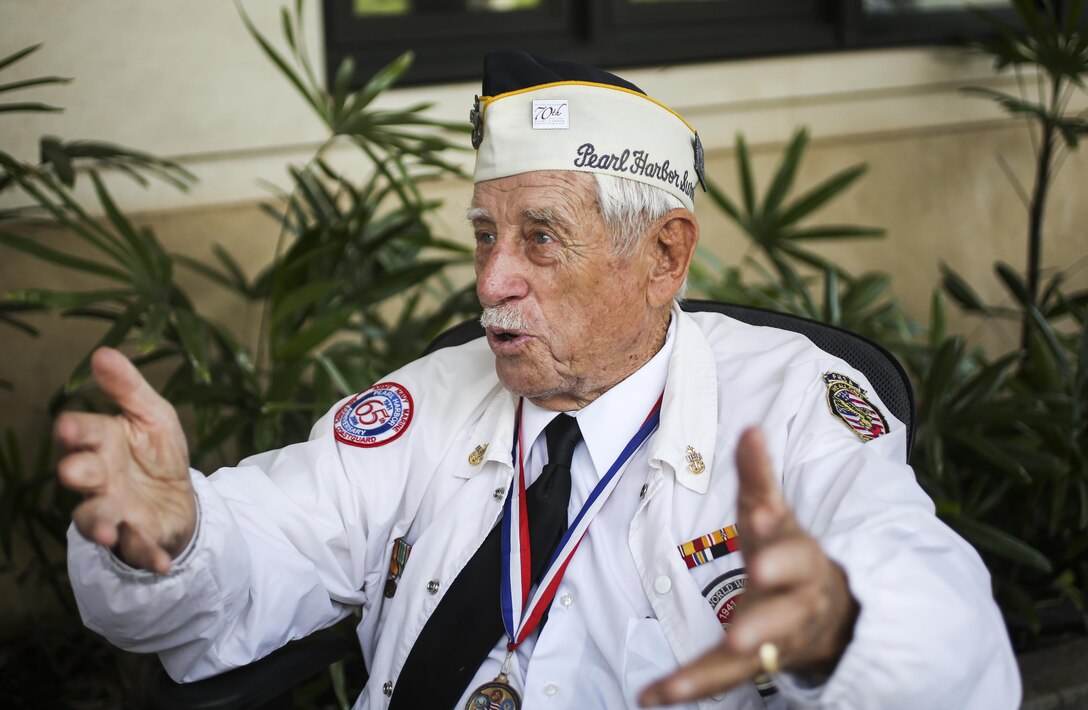 Pearl Harbor Survivor, Delton E. Walling, describes what it was like to be on post in a signal tower during the December 7, 1941 attack.  He made himself available for visitors to ask questions after he attended the Pearl Harbor Colors, Honors and Heritage Ceremony at the World War II Valor in the Pacific National Monument, Hawaii, Nov. 19, 2015. The ceremony is held once a month to honor the sacrifices of our armed forces, both those serving now and those have served.