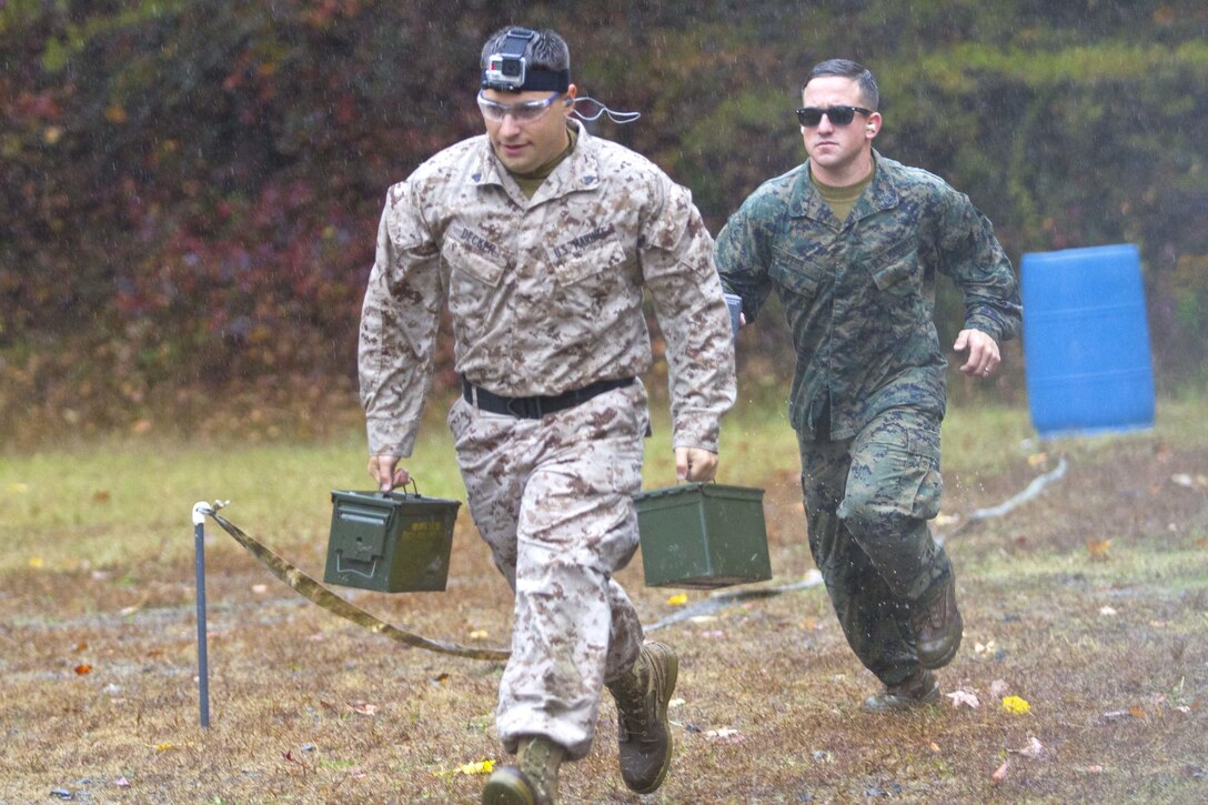 Cpl. Alexander Decker, Marksmanship Programs Management System, and Staff Sgt. James Fehr, Weapons Training Battalion range officer, participate in the fifth annual Combat Shooting Competition Oct. 28 hosted by Weapons Training Battalion aboard Marine Corps Base Quantico.  The week-long tournament challenged Marines in the application of basic fundamentals of marksmanship in a simulated combat environment.