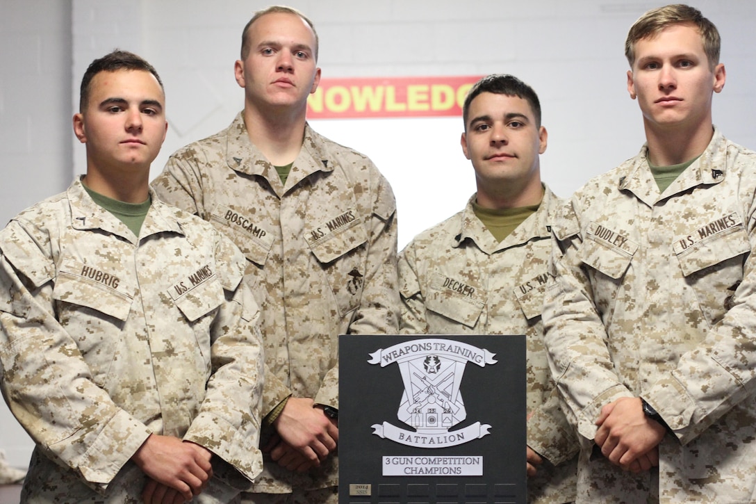 The Marine Wing Support Squadron Team, Private 1st Class Maison Hubrig, Lance Cpl. Connor Boscamp, Cpl. Alexander Decker, and Cpl. David Dudley, from Marine Corps Air Station New River, N.C., won the overall team three-gun competition Oct. 30, at the Combat Shooting Competition hosted by Weapons Training Battalion. The weeklong tournament challenged Marines in the application of basic fundamentals of marksmanship in a simulated combat environment. Infantrymen competed against Marines from Quantico, Marine Corps Air Station New River and Marine Corps Base Camp Lejeune participated in the competition.
