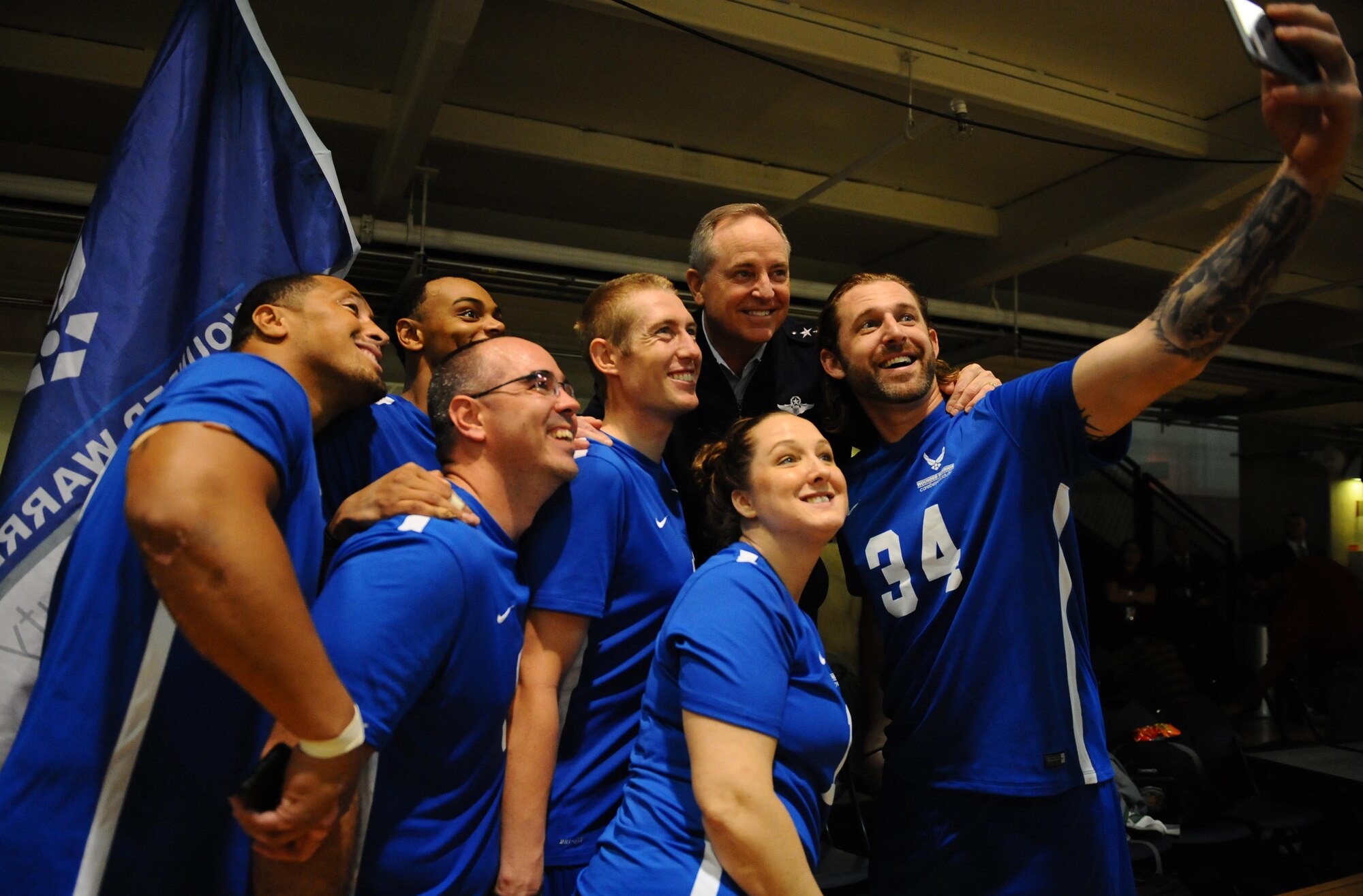Air Force Chief of Staff Gen. Mark A. Welsh III takes a selfie with Air Force wounded warriors after they won the Warrior Care Month Sitting Volleyball Tournament championship match at the Pentagon in Washington, D.C., Nov. 19, 2015. The Air Force team edged out the Marines in the final match. (U.S. Air Force photo/Senior Airman Hailey Haux) 