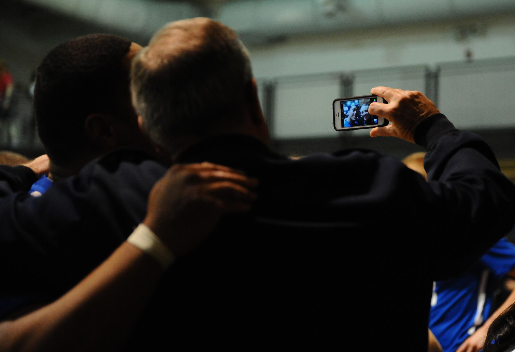 Air Force Chief of Staff Gen. Mark A. Welsh III takes a selfie with Air Force wounded warriors after they won the Warrior Care Month Sitting Volleyball Tournament championship match at the Pentagon in Washington, D.C., Nov. 19, 2015. The Air Force team edged out the Marines in the final match. (U.S. Air Force photo/Senior Airman Hailey Haux)