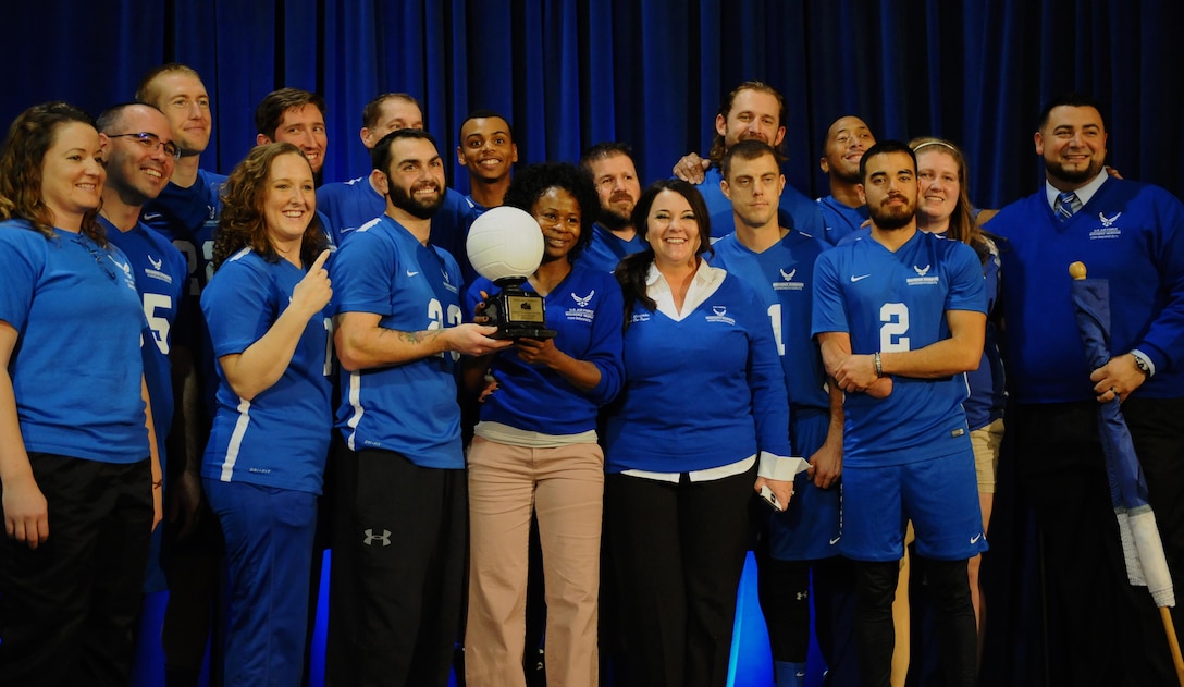 The Air Force Wounded Warrior Team pose for photos with the 1st place trophy after winning the Warrior Care Month Sitting Volleyball Tournament championship game at the Pentagon in Washington, D.C., Nov. 19, 2015. The Air Force edged out the Marines during the final match. (U.S. Air Force photo/Senior Airman Hailey Haux)