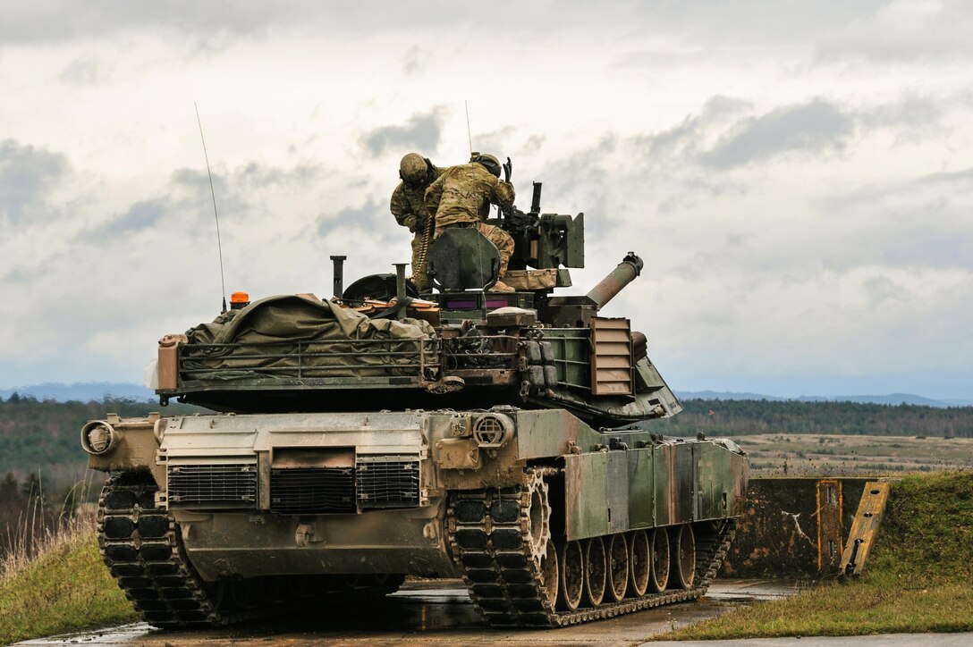 U.S. Soldiers load the .50-caliber machine gun of an M1A2 SEPv2 Abrams main battle tank during a combined arms live-fire exercise in Grafenwoehr, Germany, Nov. 19, 2015. The exercise was the culminating event for Combined Resolve V, a U.S. Army Europe-directed multinational exercise with more than 4,600 participants from 13 NATO and European partner nations. U.S. Army photo by Markus Rauchenberger