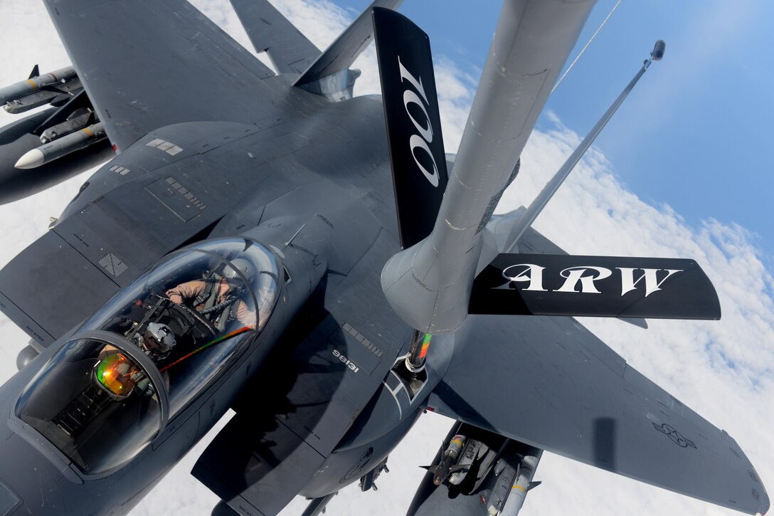 A KC-135 Stratotanker refuels an F-15E Strike Eagle over the northern Mediterranean Sea, Nov. 12, 2015. The Stratotanker is assigned to the 100th Air Refueling Wing and the Strike Eagle is assigned to the 48th Fighter Wing. Both wings will work together supporting Operation Inherent Resolve while deployed to Incirlik Air Base, Turkey. U.S. Air Force photo by Senior Airman Kate Thornton