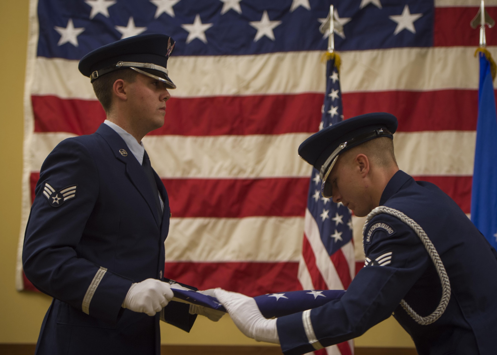 The Hurlburt Field Honor Guard folds a flag during Col. Ted. Corallo’s, retirement ceremony at the Soundside Club on Hurlburt Field, Fla., Nov. 20, 2015. During his career, Corallo piloted 10 different aircraft platforms including the Cessna T-37, MC-130H Combat Talon II, and the CV-22B Osprey. He served as the Air Force Special Operations Command chief of staff for the last 18 months. (U.S. Air Force photo by Senior Airman Christopher Callaway)