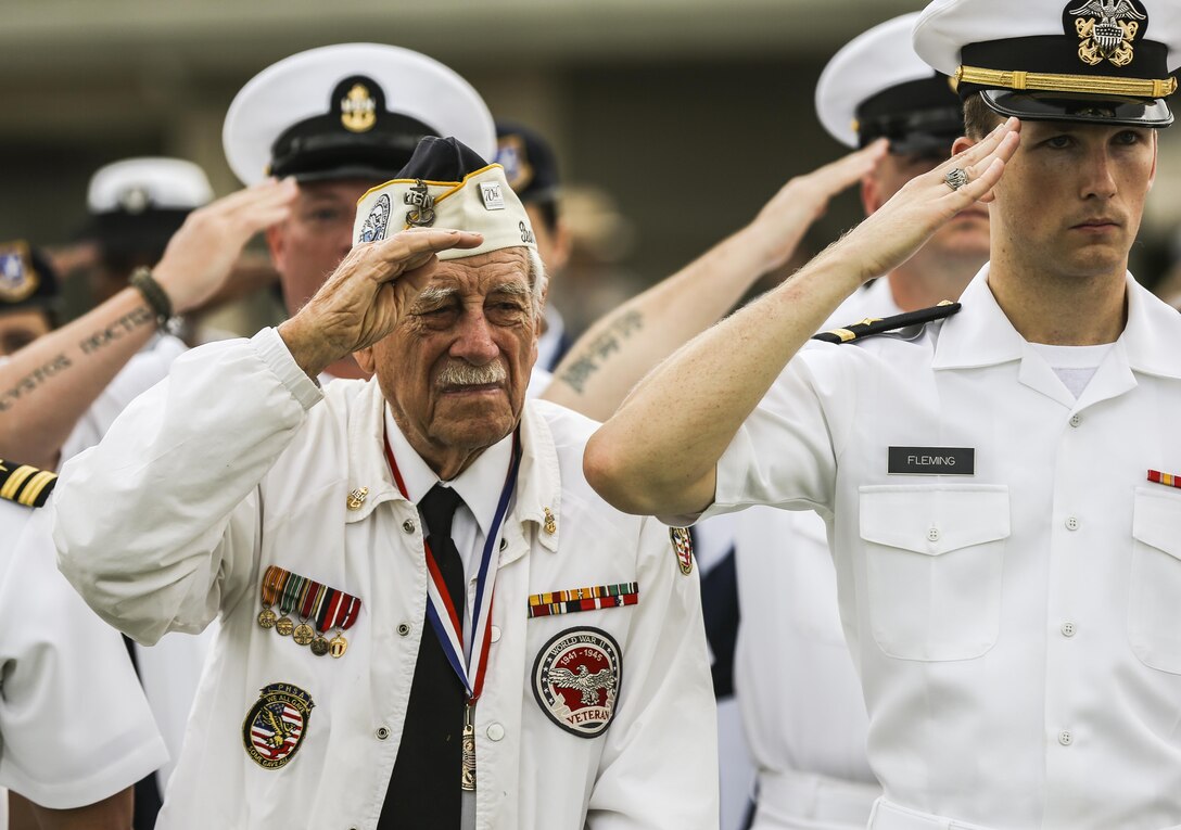 Pearl Harbor Survivor, Delton E. Walling, renders honors during the National Anthem at the Pearl Harbor Colors, Honors and Heritage Ceremony at the World War II Valor in the Pacific National Monument, Hawaii, Nov. 19, 2015. The ceremony is held once a month to honor the sacrifices of our armed forces, both those serving now and those have served. 
