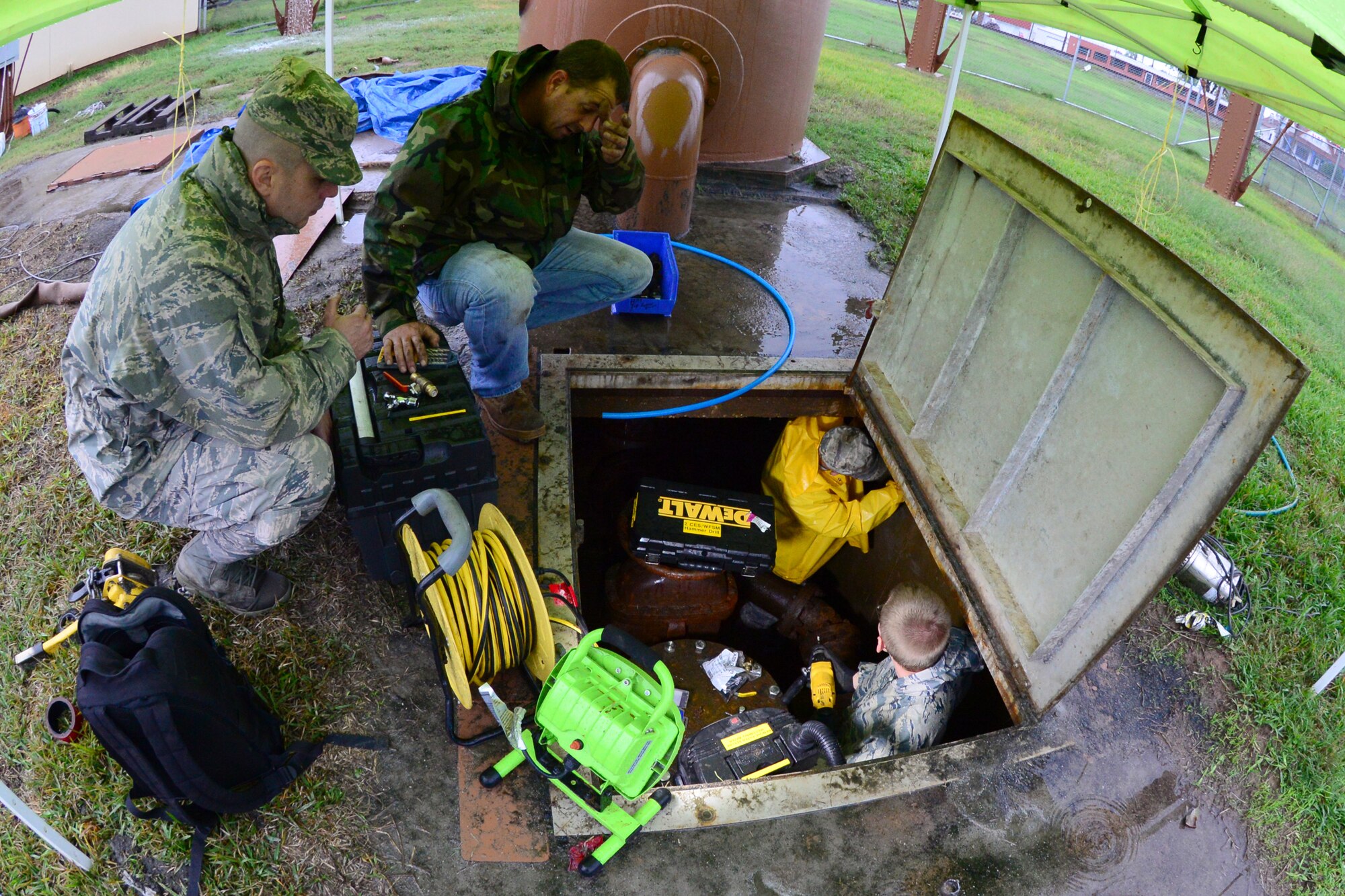 Airmen from the 2nd Civil Engineer Squadron water and fuel systems replace sensing wire to a water tower outside main gate on Barksdale Air Force Base, La., Nov. 17, 2015. The sensing line detects how much water is in the tower and prevents it from overfilling. (U.S. Air Force Photo/Airman 1st Class Luke Hill)