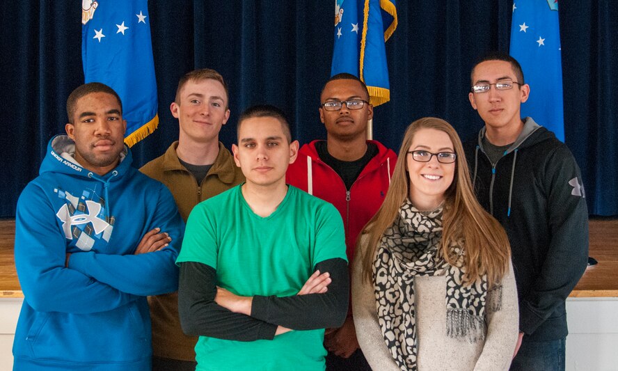 (From left to right) Senior Airman Tyree Wright, 90th Maintenance Operations Squadron Vehicles and Equipment Section technician; Senior Airman Devin Mooney, 321st Missile Squadron Personnel Reliability Program monitor; Airman 1st Class Robert Andrade, 90th Civil Engineer Squadron heating, ventilation and air conditioning technician; Airman 1st Class Jabron Sparks, 790th Missile Security Forces Squadron; Senior Airman Nina Jones, 90th Medical Group Commander's Support Staff; and Airman 1st Class Roberto Apodaca, 90th MSFS -- all of whom are 90th Missile Wing Honor Guard ceremonial guardsmen -- pose for a photo in the Pronghorn Center on F.E. Warren Air Force Base, Wyo., Nov. 20, 2015. The Airmen helped an 18-wheeler driver stay safe and warm until emergency responders arrived on scene Nov. 18, 2015. (U.S. Air Force photo by Senior Airman Jason Wiese)