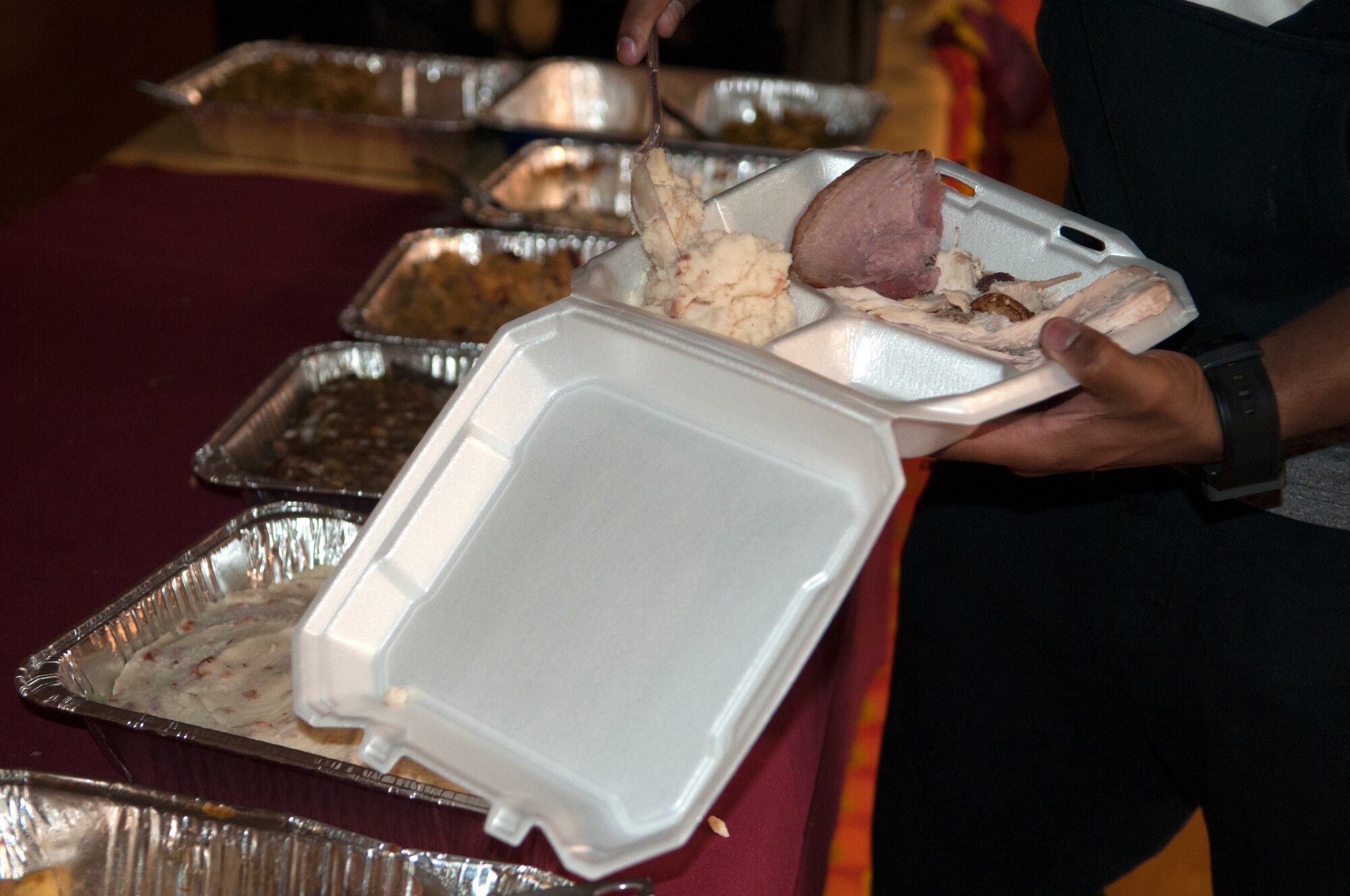 The chapel community, which consists of people from the traditional, Catholic and contemporary services, provided food for the chapel’s Thanksgiving dinner Nov. 19, 2015, in the Fall Hall Community Center. After dinner, Airmen and those from the chapel community were offered a variety of activities to connect, including rock climbing, laser tag and ping pong. (U.S. Air Force photo by Airman 1st Class Malcolm Mayfield)