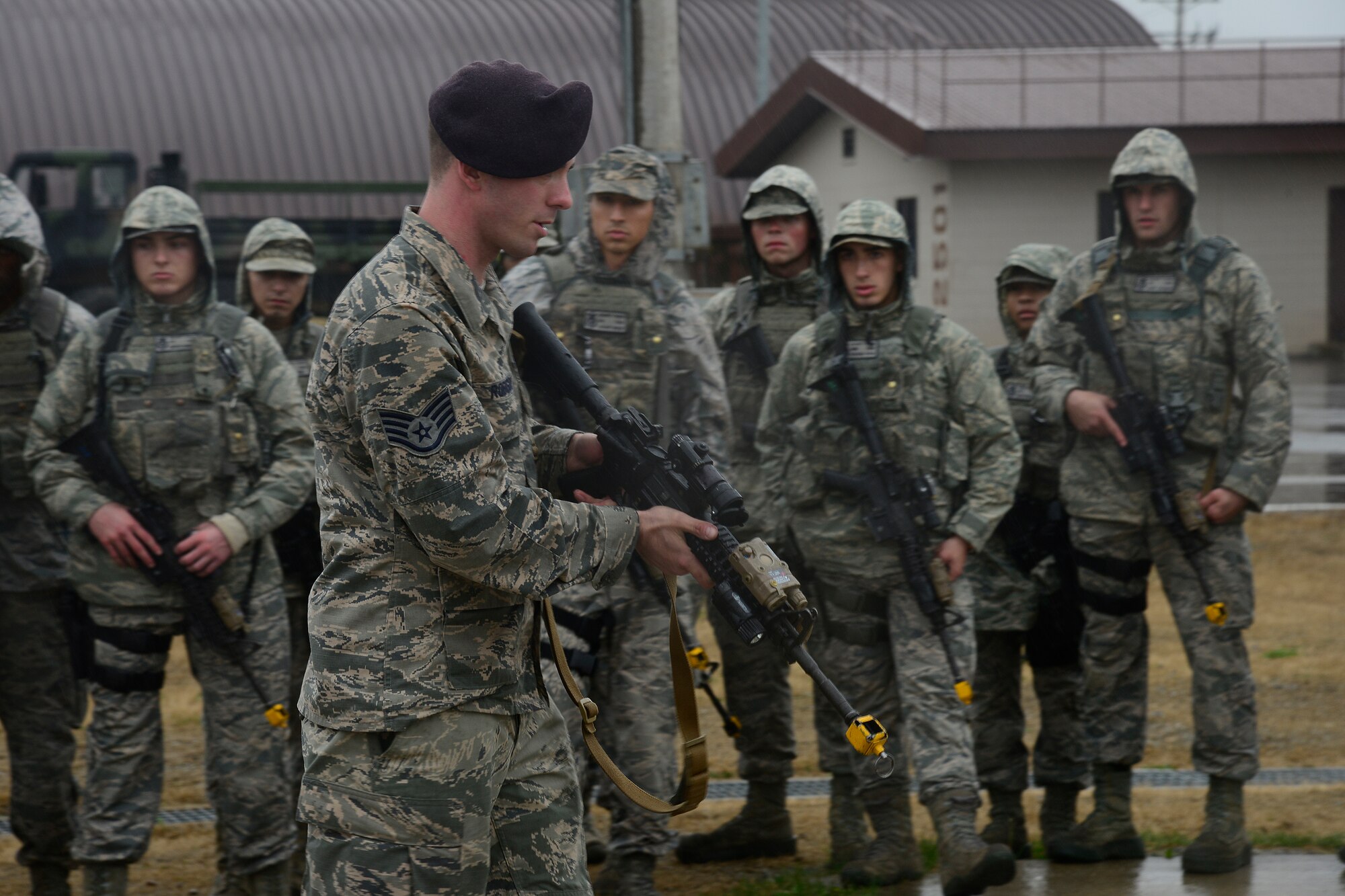 Staff Sgt. Aaron Robison, 51st Security Forces Squadron training instructor, demonstrates weapons tactics during the combat readiness course on Osan Air Base, Republic of Korea, Nov. 17, 2015. The five-day course is designed to teach or re-teach the defenders to perform communicative, tactical, and emergency procedures through simulated environments ensuring they're prepared for real-world contingencies. (U.S. Air Force photo/Senior Airman Kristin High)