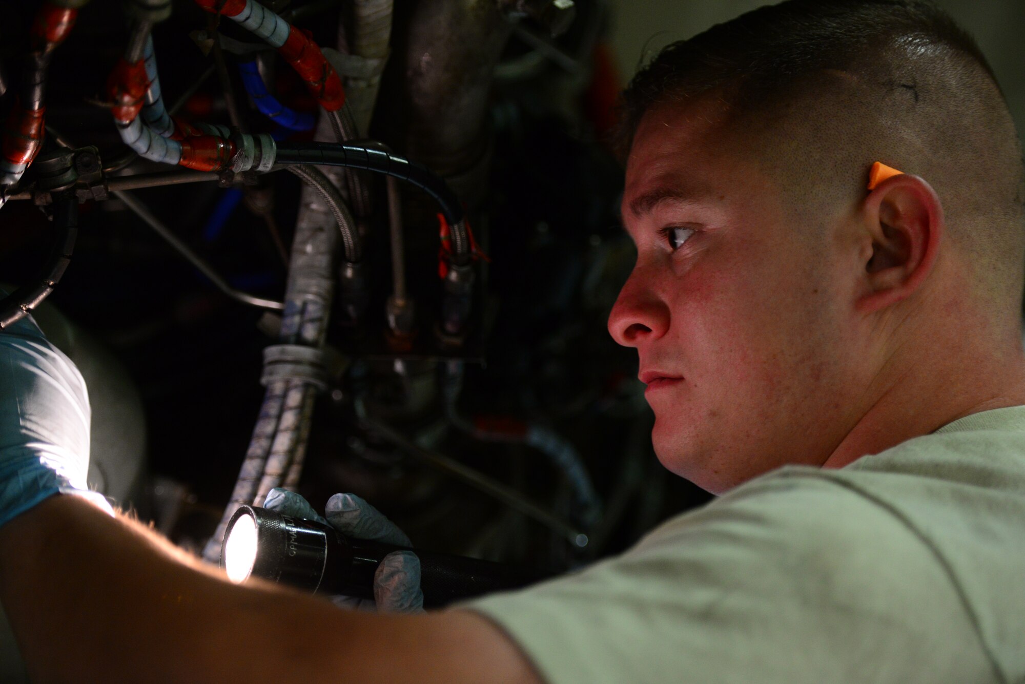Staff Sgt. David Davis, 51st Maintenance Group aerospace propulsion craftsman, performs routine maintenance on an A-10 Thunderbolt II engine during a phase inspection at Osan Air Base, Republic of Korea, Nov. 16, 2015. Davis primarily works changing filters and inspecting equipment to make sure that each part is safe and usable, replacing them as needed. (U.S. Air Force photo/Staff Sgt. Amber Grimm)