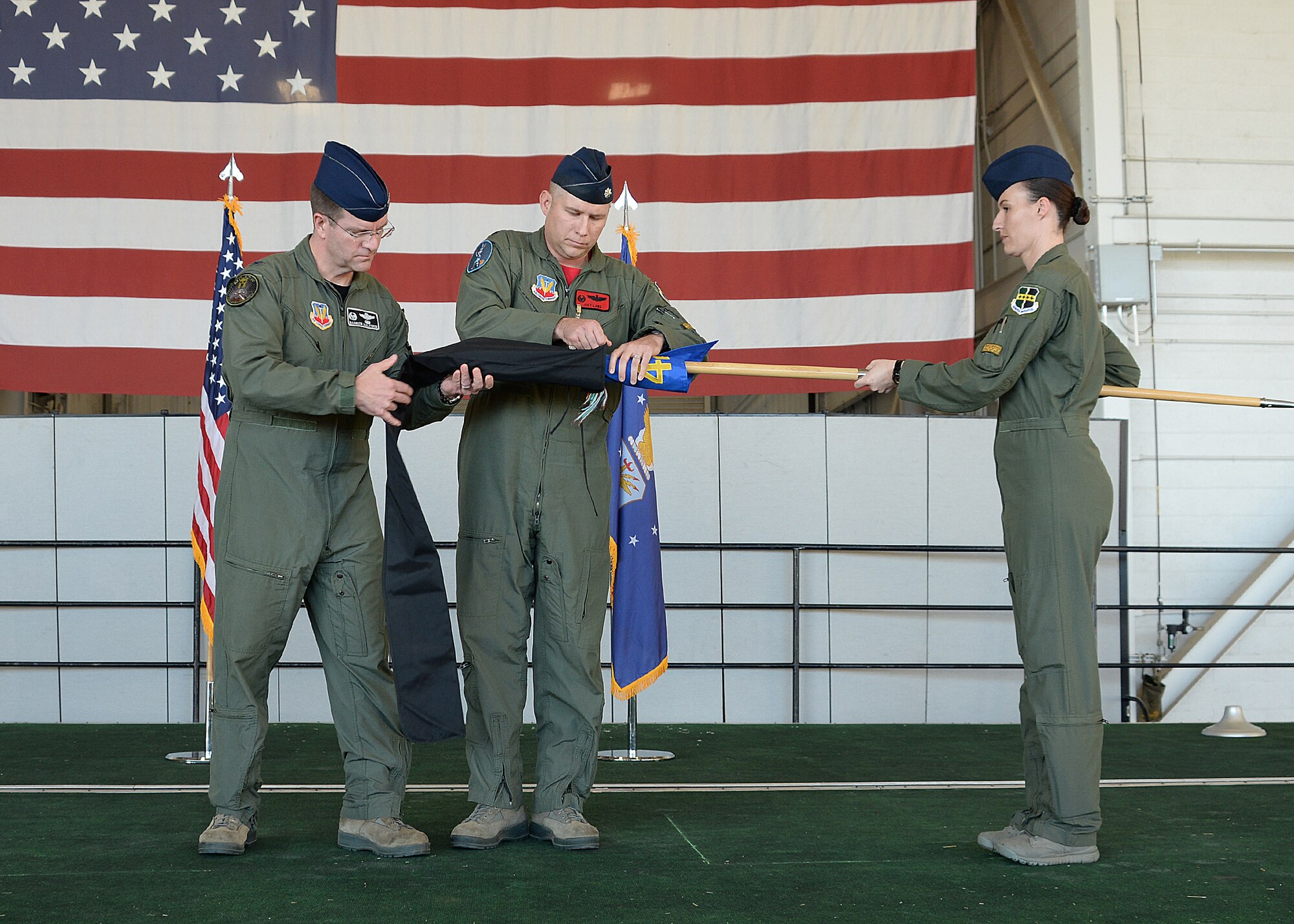 Col. Darren B. Halford, 9th Operations Group commander and Lt. Col. Joseph Laws, 427th Reconnaissance Squadron commander, case the unit flag during an inactivation ceremony Nov. 20, 2015, at Beale Air Force Base, California.  MC-12W Liberty Airmen from the past and present attended the ceremony and reception to reminisce about their time supporting the MC-12 mission. Since May 2012, the 427th RS has deployed and trained 455 Airmen, flown 4,770 combat missions, eliminated 503 enemy combatants, and saved countless coalition lives. (U.S. Air Force photo by Robert Scott)