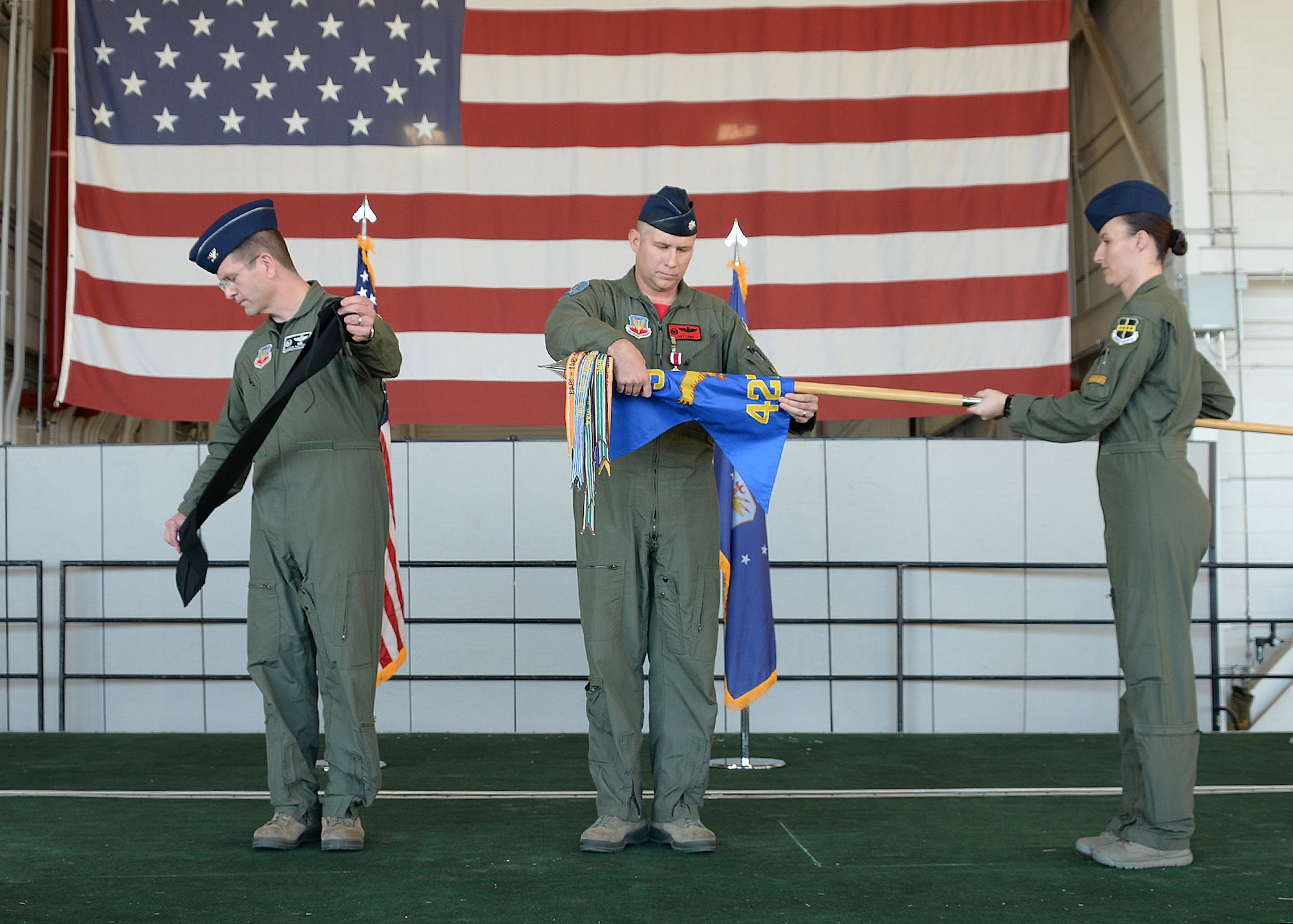 Col. Darren B. Halford, 9th Operations Group commander and Lt. Col. Joseph Laws, 427th Reconnaissance Squadron commander, prepare to case the unit flag during an inactivation ceremony Nov. 20, 2015, at Beale Air Force Base, California.  MC-12W Liberty Airmen from the past and present attended the ceremony and reception to reminisce about their time supporting the MC-12 mission. Since May 2012, the 427th RS has deployed and trained 455 Airmen, flown 4,770 combat missions, eliminated 503 enemy combatants, and saved countless coalition lives. (U.S. Air Force photo by Robert Scott)