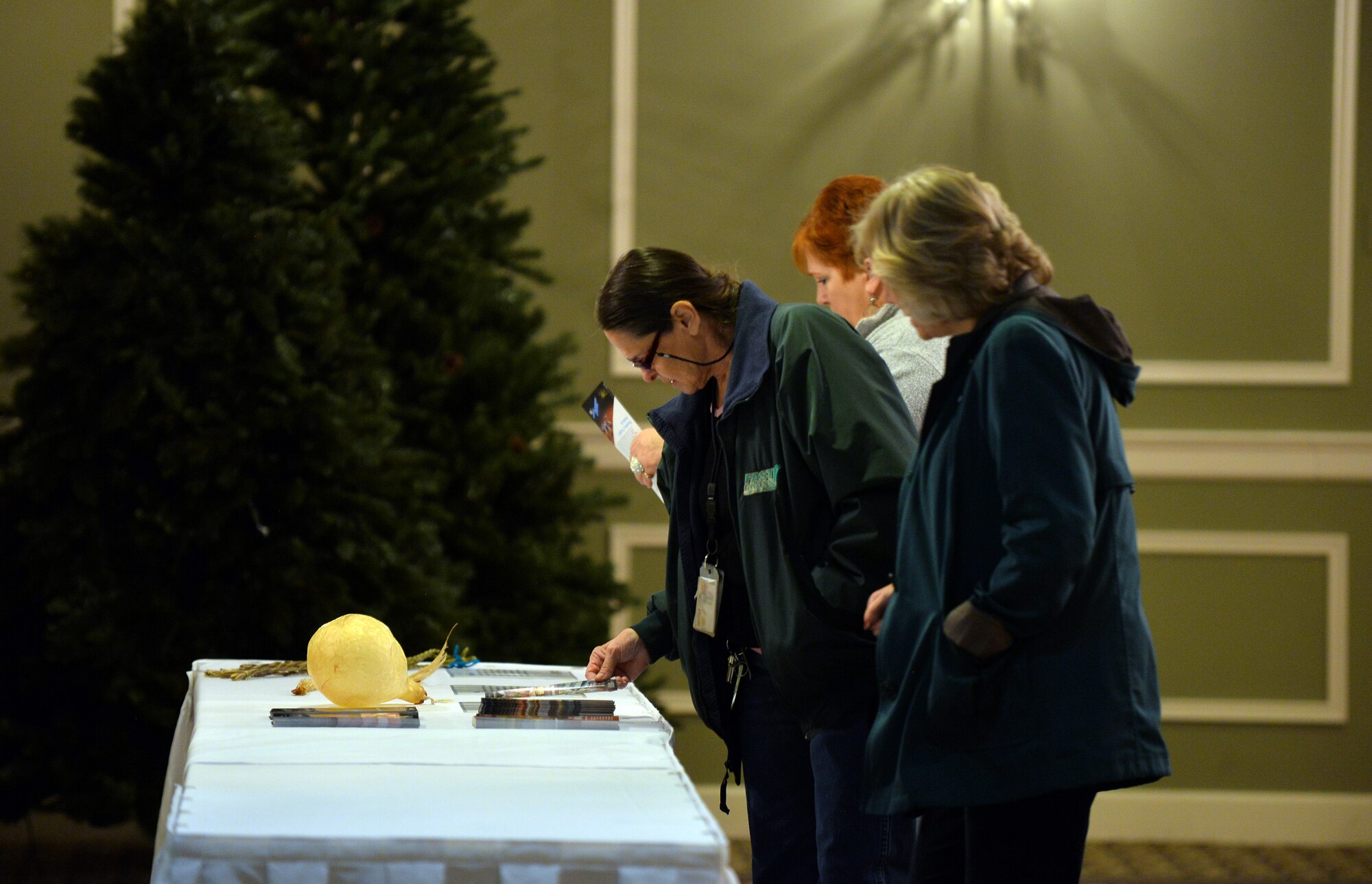 Members of Team Offutt browse artifacts on loan from the Durham Museum Nov. 18, 2015, during the Native American Heritage Month Cultural Information Fair and Expo at the Patriot Club, Offutt Air Force Base, Neb. The Museum is located in downtown Omaha inside an old train station. (U.S. Air Force photo by Josh Plueger)