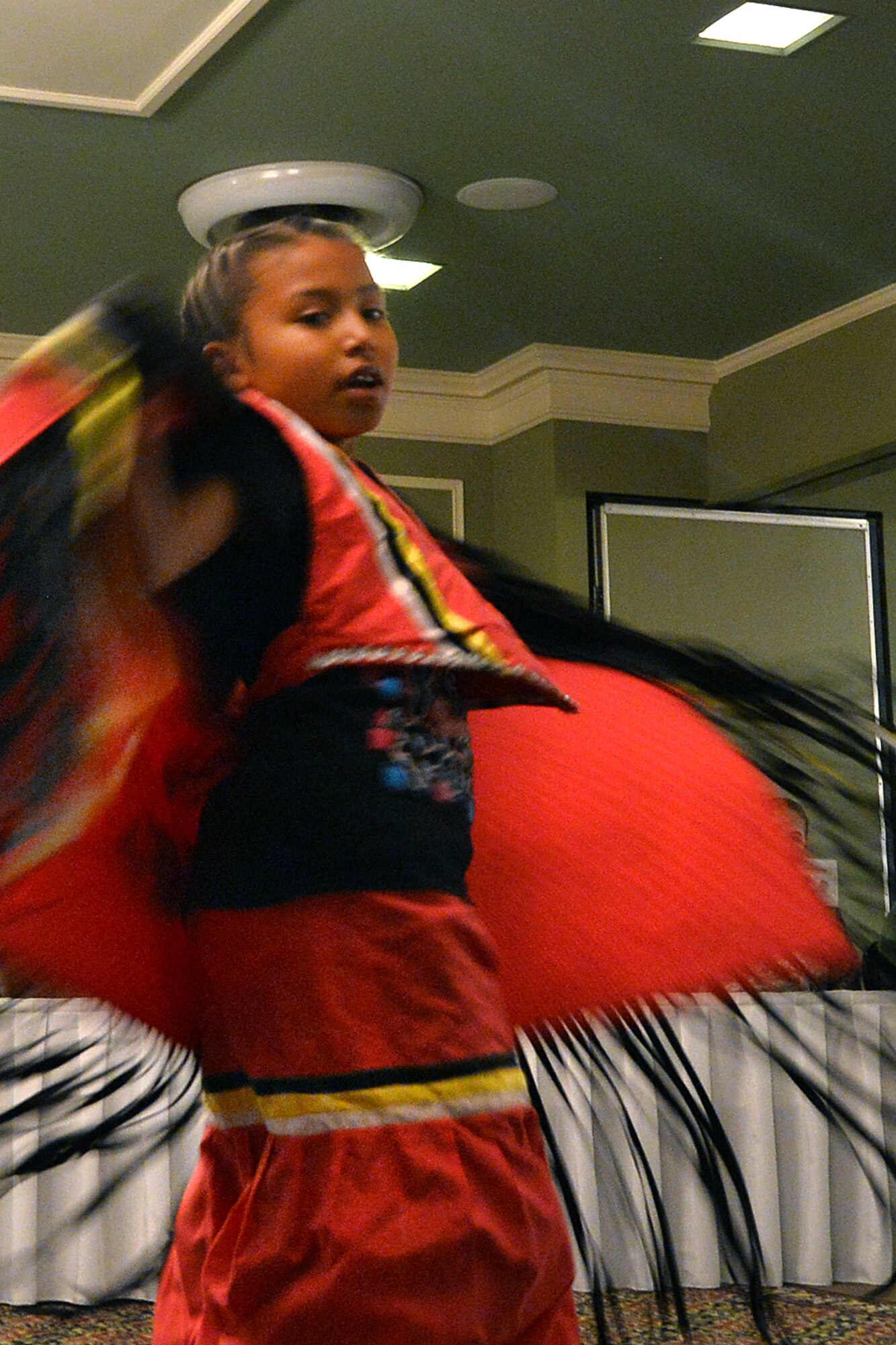 Aubrey Barea performs the Fancy Shawl dance Nov. 18, 2015, during the Native American Heritage Month Cultural Information Fair and Expo at the Patriot Club, Offutt Air Force Base, Neb. Barea is in fourth grade and a member of the Sicangu Tribe. (U.S. Air Force photo by Josh Plueger)