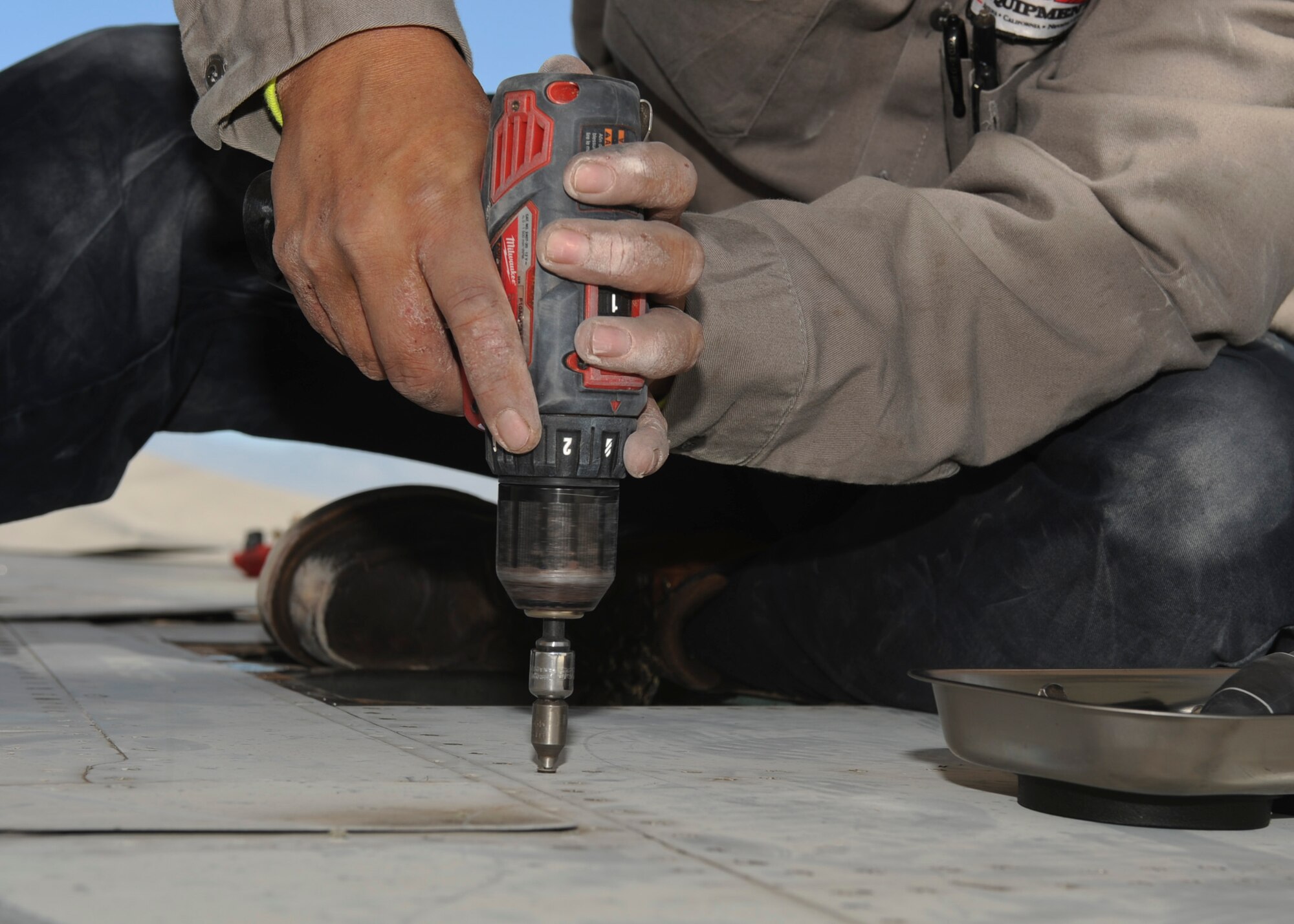 Tony Martinez, crane mechanic, removes a panel from an F-15A Eagle on the flightline at Davis-Monthan Air Force Base, Ariz., Nov. 17, 2015.  A team of contractors took five days to completely disassemble the F-15A Eagle and load it onto two flatbed trucks to be shipped to Joint Base Lewis-McChord, Wash., for display. The entire project is estimated to take approximately eight months from the planning stage to finish. (U.S. Air Force photo by Airman Basic Nathan H. Barbour/Released)