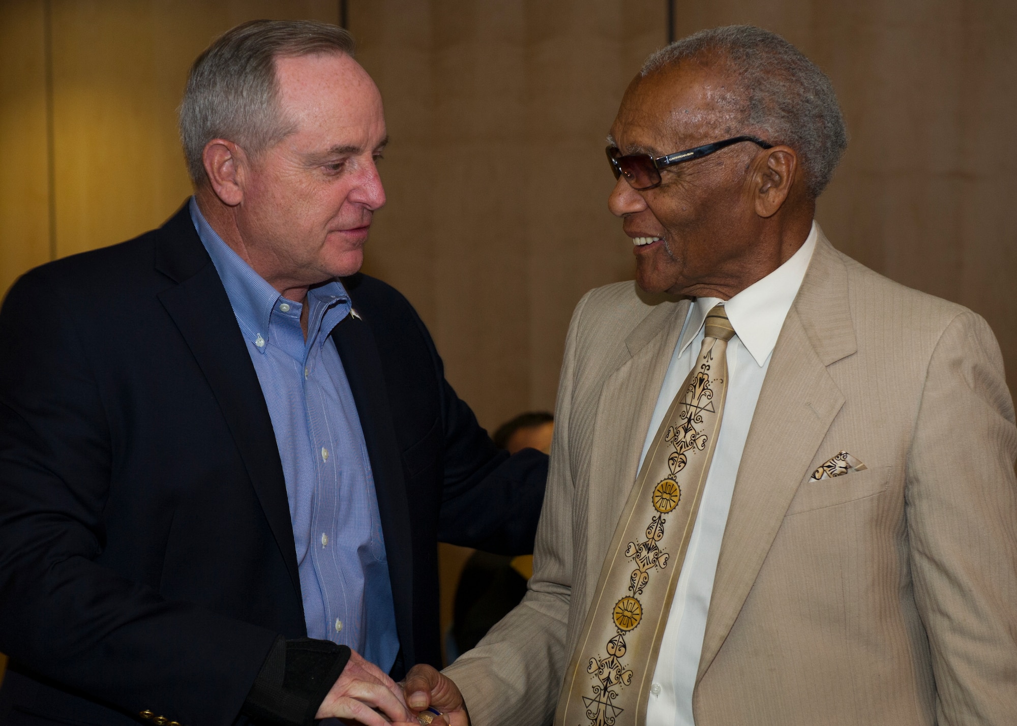 Air Force Chief of Staff Gen. Mark A. Welsh lll recognizes George Gregory, former 746th Test Squadron Operations Flight chief, with a coin for his outstanding support to Holloman, over his 54 years of service to the base. Welsh recognized Gregory at the civic leader dinner held on Holloman Air Force Base, New Mexico on Nov. 16th. His visit also included a tour of the base facilities and the different squadrons here. His base-wide brief focused on future plans for the Air Force, including providing opportunities for the Remotely Piloted Aircraft career fields. (U.S. Air Force photo by Senior Airman Leah Ferrante)