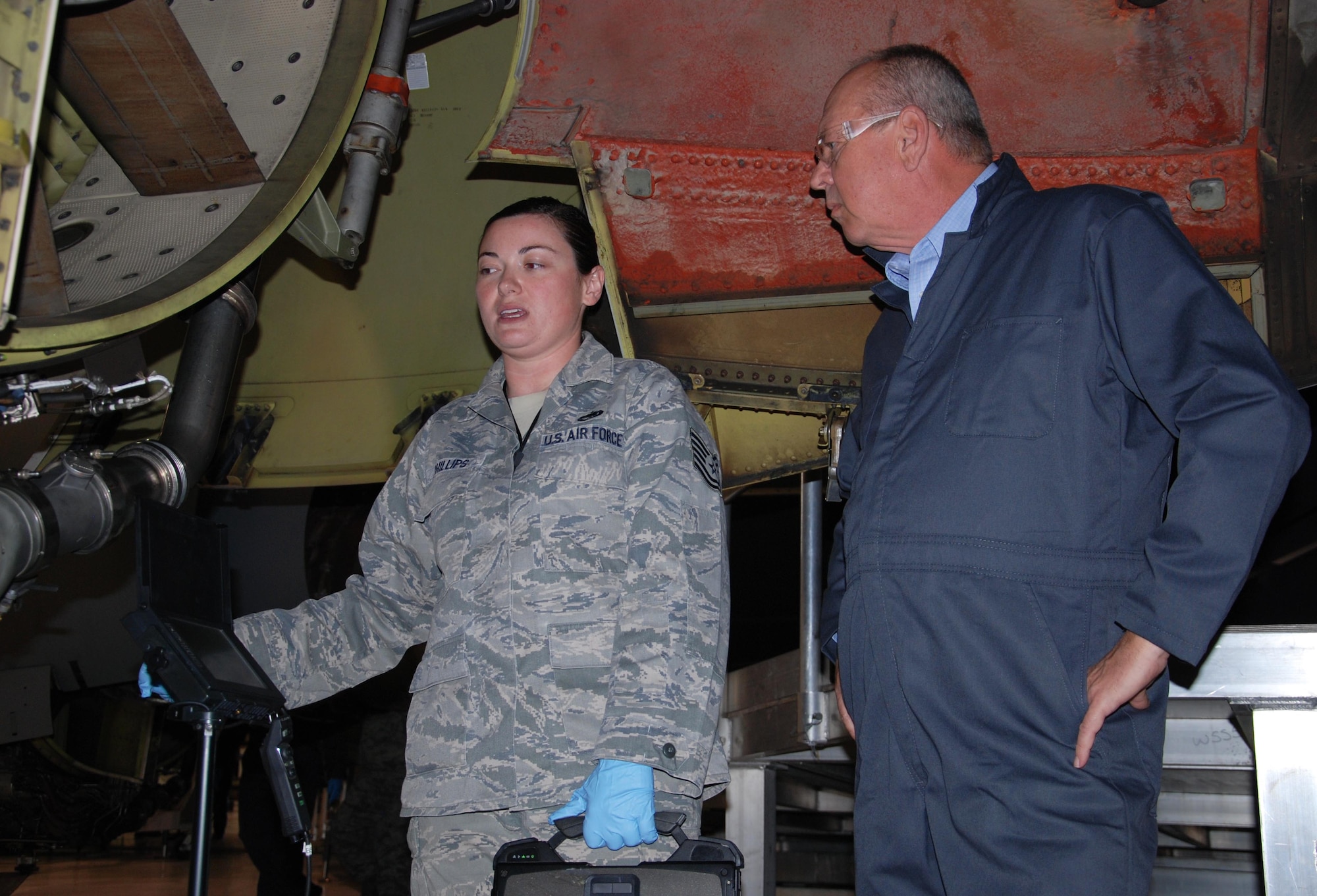Tech. Sgt. Anne Phillips, 931st Maintenance Squadron jet engine mechanic, discusses her job with one of the 19 Air Mobility Commanders, Nov. 17, 2015, at McConnell Air Force Base, Kan. The tour was an opportunity for the civic leaders to view Team McConnell's aerial refueling mission firsthand. (U.S. Air Force photo by Tech. Sgt. Abigail Klein)