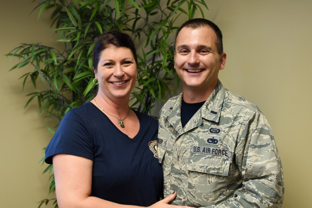 1st Lt. Lonnie Nicholson stands with his wife Amie Nicholson after receiving a presentation on the wing’s new mission sets and provided tips for their physical and mental health at Ebbing Air National Guard Base, Fort Smith, Ark., Nov. 7, 2015. Lonnie Nicholson has been with the 188th Wing since 1997. Amie Nicholson volunteers at the 188th as a member of the wing key spouses program. (U.S. Air National Guard photo by Senior Airman Cody Martin/Released)