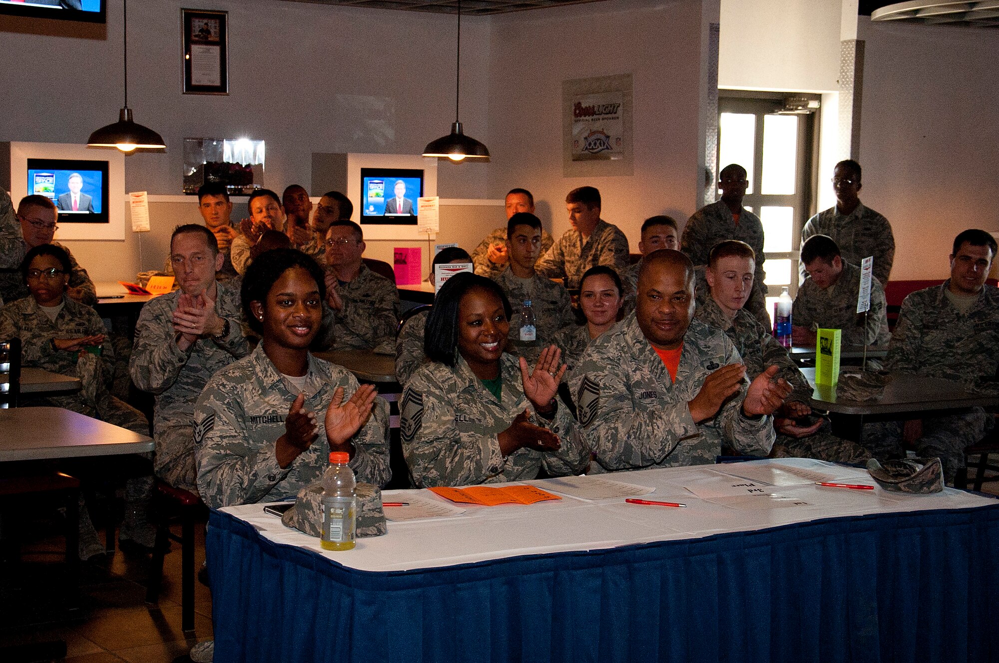 Airmen assigned to 6th Air Mobility Wing applaud in support of the talent show performers, Nov. 13, 2015 at MacDill Air Force Base, Fla. The Junior Enlisted Council hosted its first ever talent show, which included six performances ranging from animation break dancing to spoken word. (U.S. Air Force photo by Senior Airman Jenay Randolph)