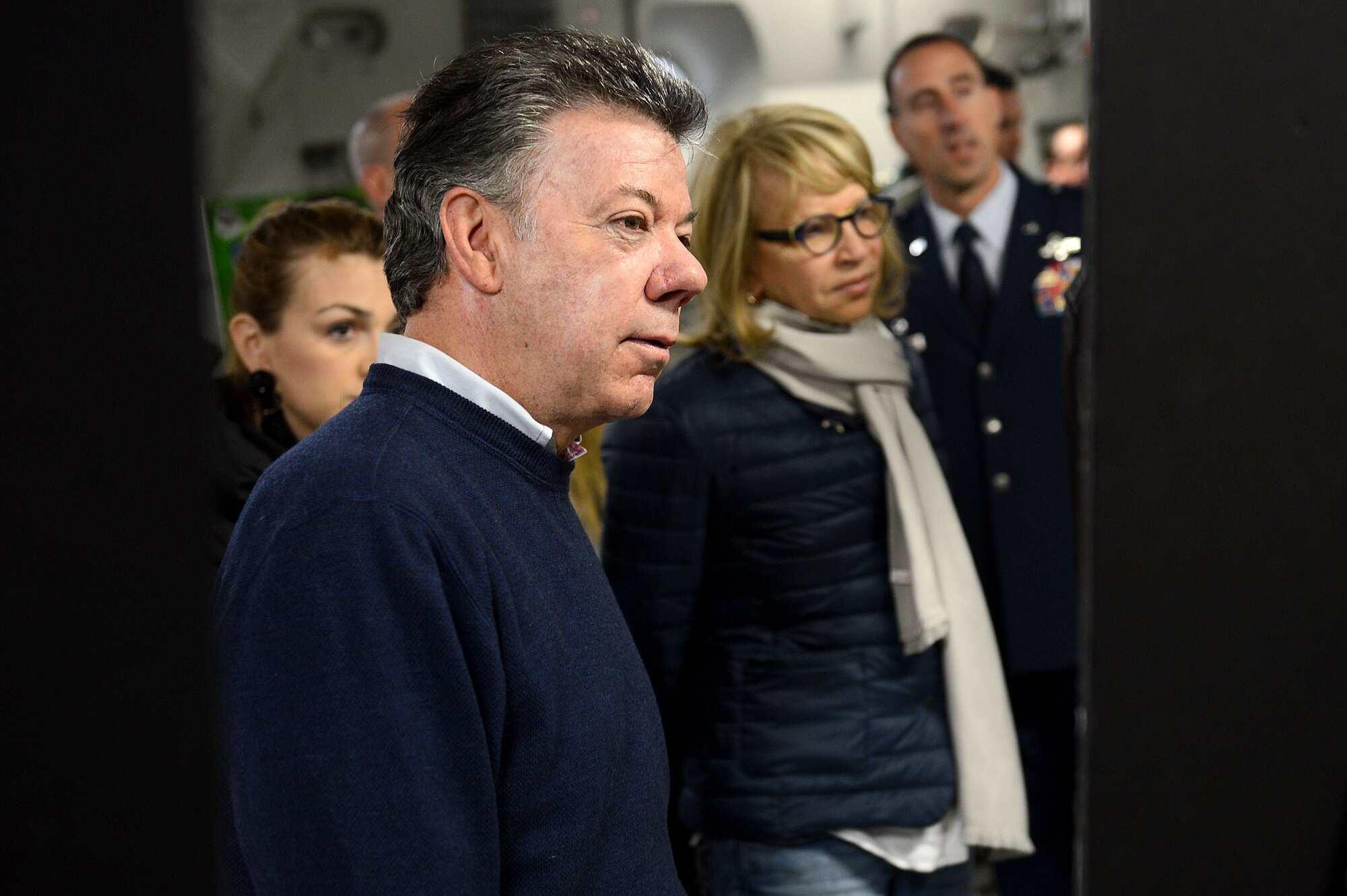 Juan Santos, President of Colombia, reads the Operation Deep Freeze mission board during a static tour inside a C-17 Globemaster III on the McChord Field flight line, Nov. 19, 2015 at Joint Base Lewis-McChord, Wash. Santos served in the Colombian Nay from 1967-1971. After leaving the Navy, he moved to the United States and graduated from the University of Kansas in 1973. (U.S. Air Force photo/Senior Airman Divine Cox)
