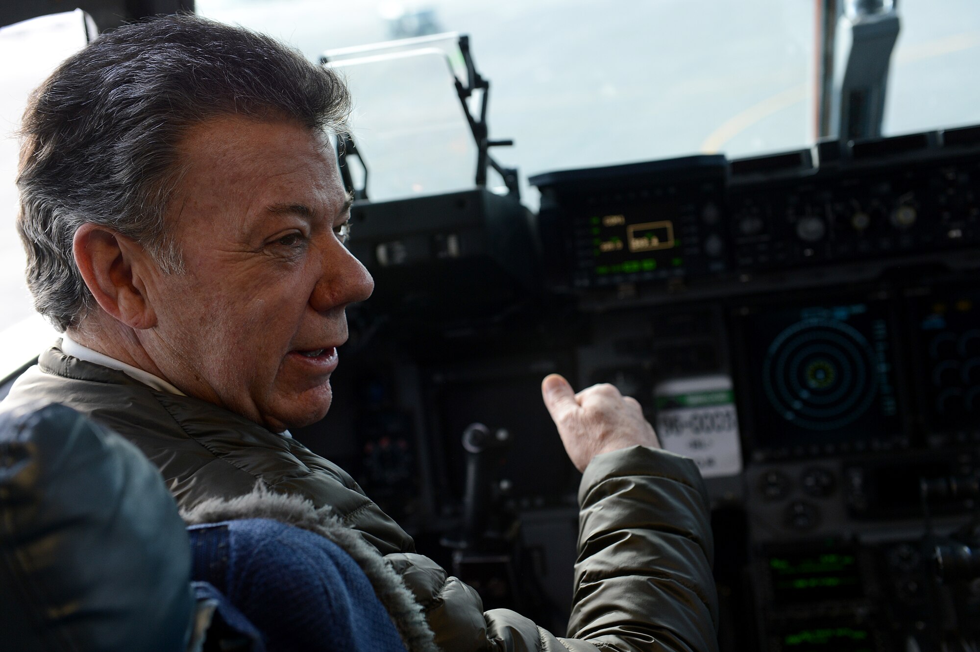 Juan Santos, President of Colombia, sits in the cockpit of a C-17 Globemaster III Nov. 19, 2015, on the McChord Field flight line at Joint Base Lewis-McChord, Wash. Santos is the 32nd President of Colombia and has been in office since 2010. (U.S. Air Force photo/Senior Airman Divine Cox) 