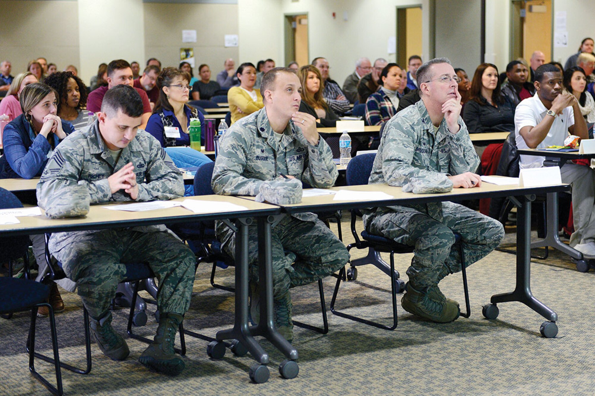Col. Brian Bruckbauer, 673d Air Base Wing and Joint Base Elmendorf-Richardson commander, right, Lt. Col. Christopher Busque, 673d Force Support Squadron commander, center, and Chief Master Sgt. George Richey, 673d Logistics Readiness Group superintendent, listen to delegates during the Fifth Annual Joint Family Action Plan Conference at the JBER Community Education Complex, Oct. 29. The conference gives command ideas of what’s going on in the community and what quality of life issues need to be fixed to make the community better.  (U.S. Air Force photo by Airman Valerie Monroy)