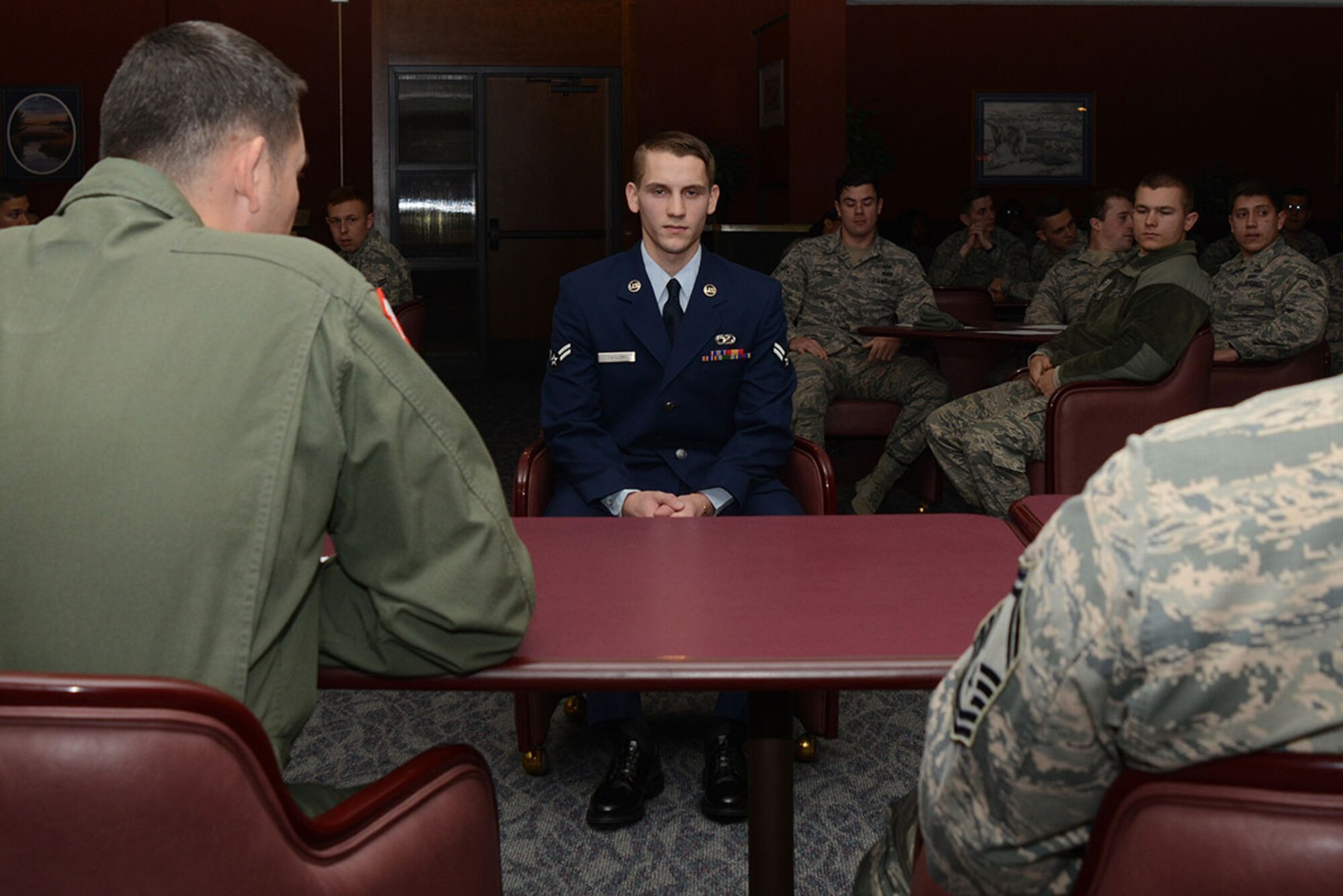 Airman 1st Class Anthony Taylor (middle), 673d Logistics Readiness Squadron vehicle management analyst, goes through the process of a mock board. The mock board was hosted by the Arctic Warrior Airman’s Advisory Council to educate new Airmen on how boards work in the Air Force. (U.S. Air Force photo/Airman 1st Class Christopher R. Morales)